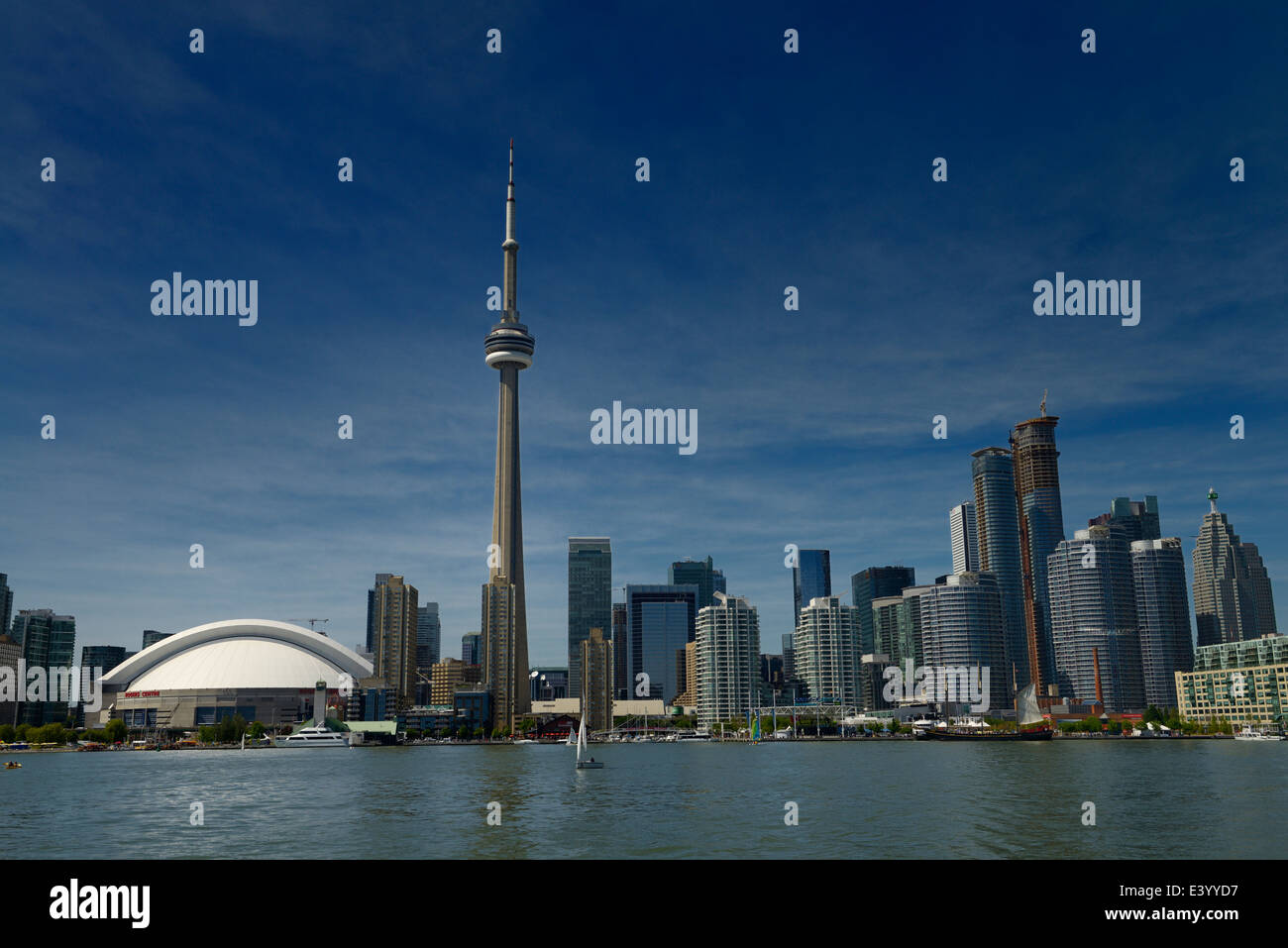 Toronto skyline with CN Tower, Rogers Centre, condo, and financial towers from Lake Ontario Toronto Island Stock Photo
