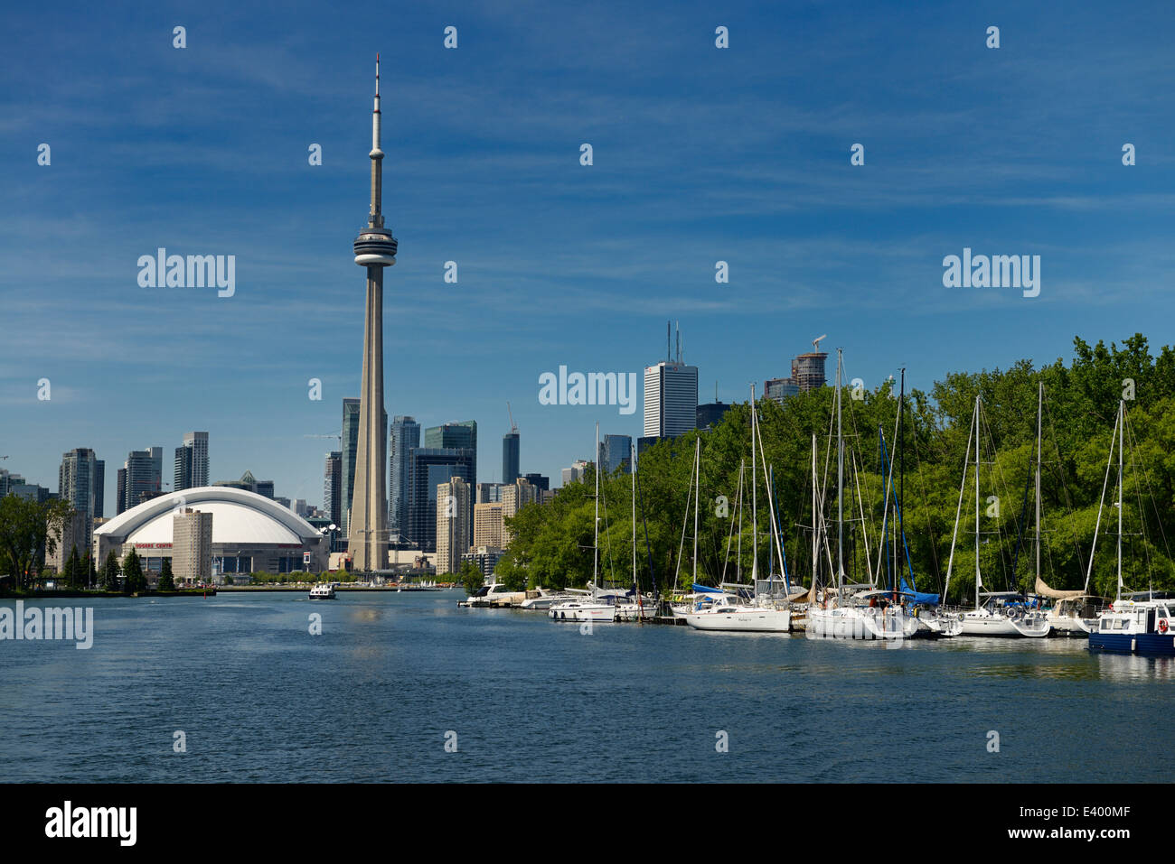 Toronto skyline and Island Yacht Club sailboats in marina from Blockhouse Bay between Hanlan and Muggs Toronto Islands Stock Photo