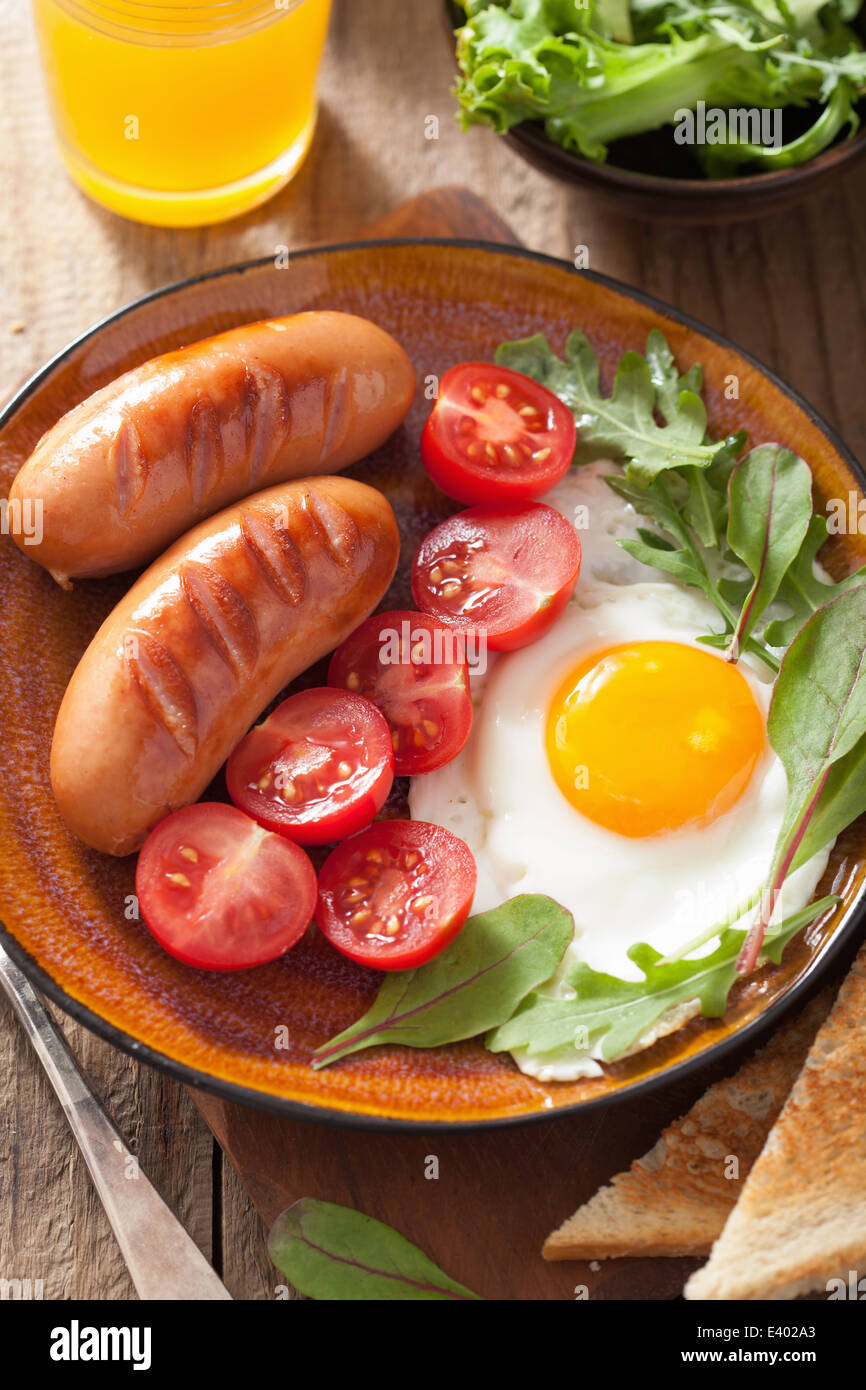 fried egg sausages tomatoes for healthy breakfast Stock Photo Alamy