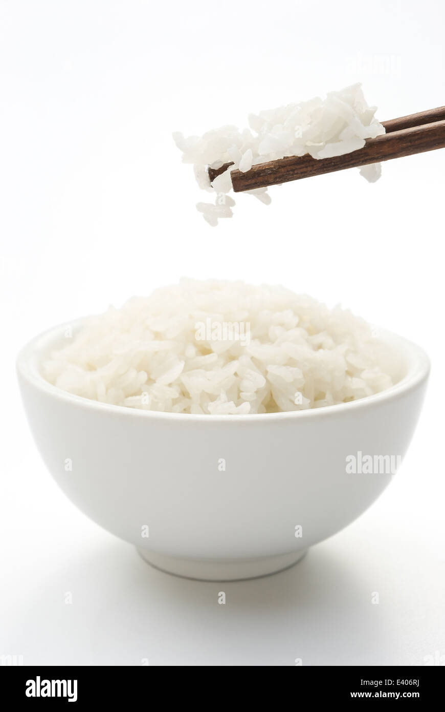 rice and chopstick on white with clipping path, vertical composition Stock Photo