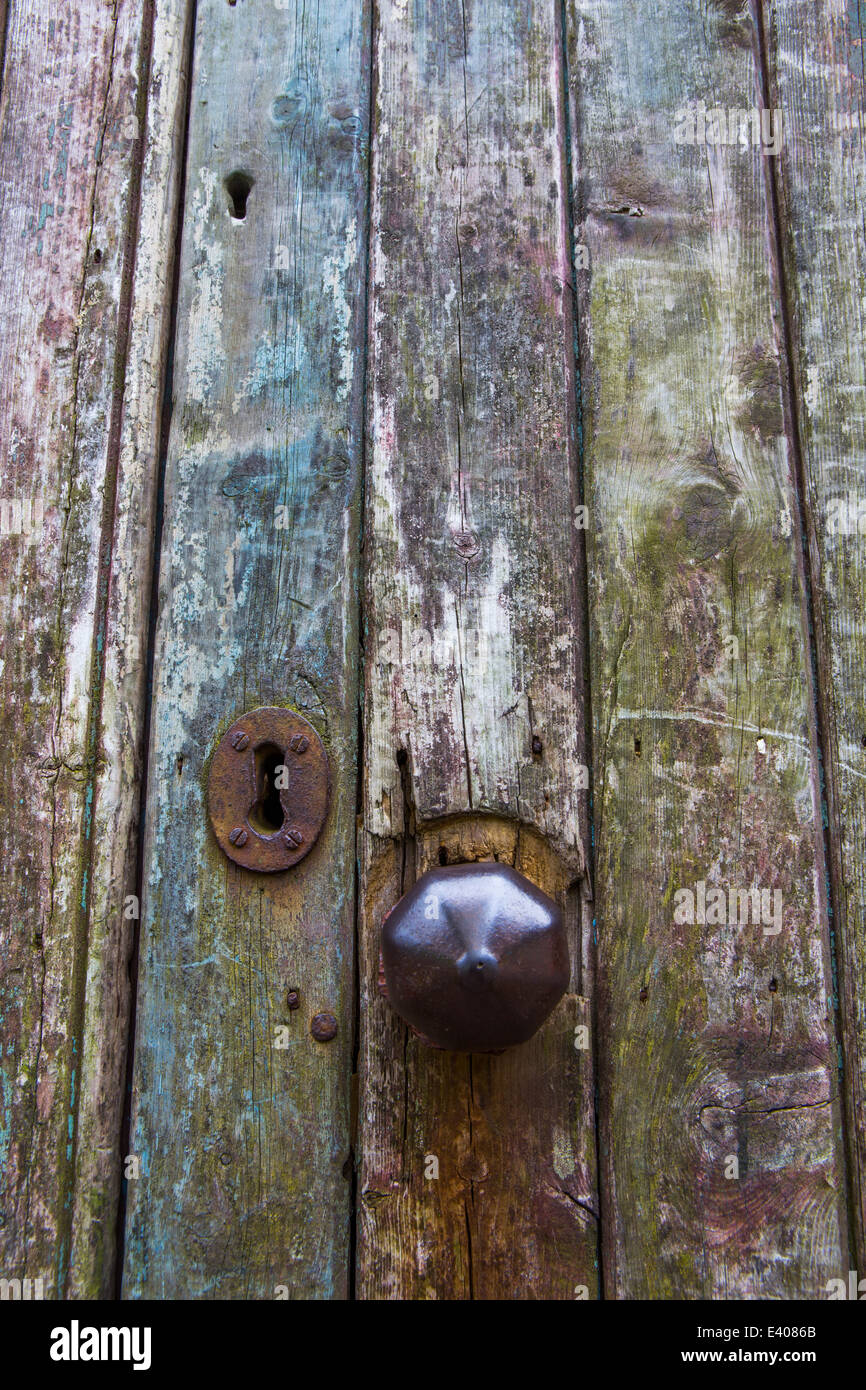 Old door handle on wooden door with rusty lock Stock Photo - Alamy