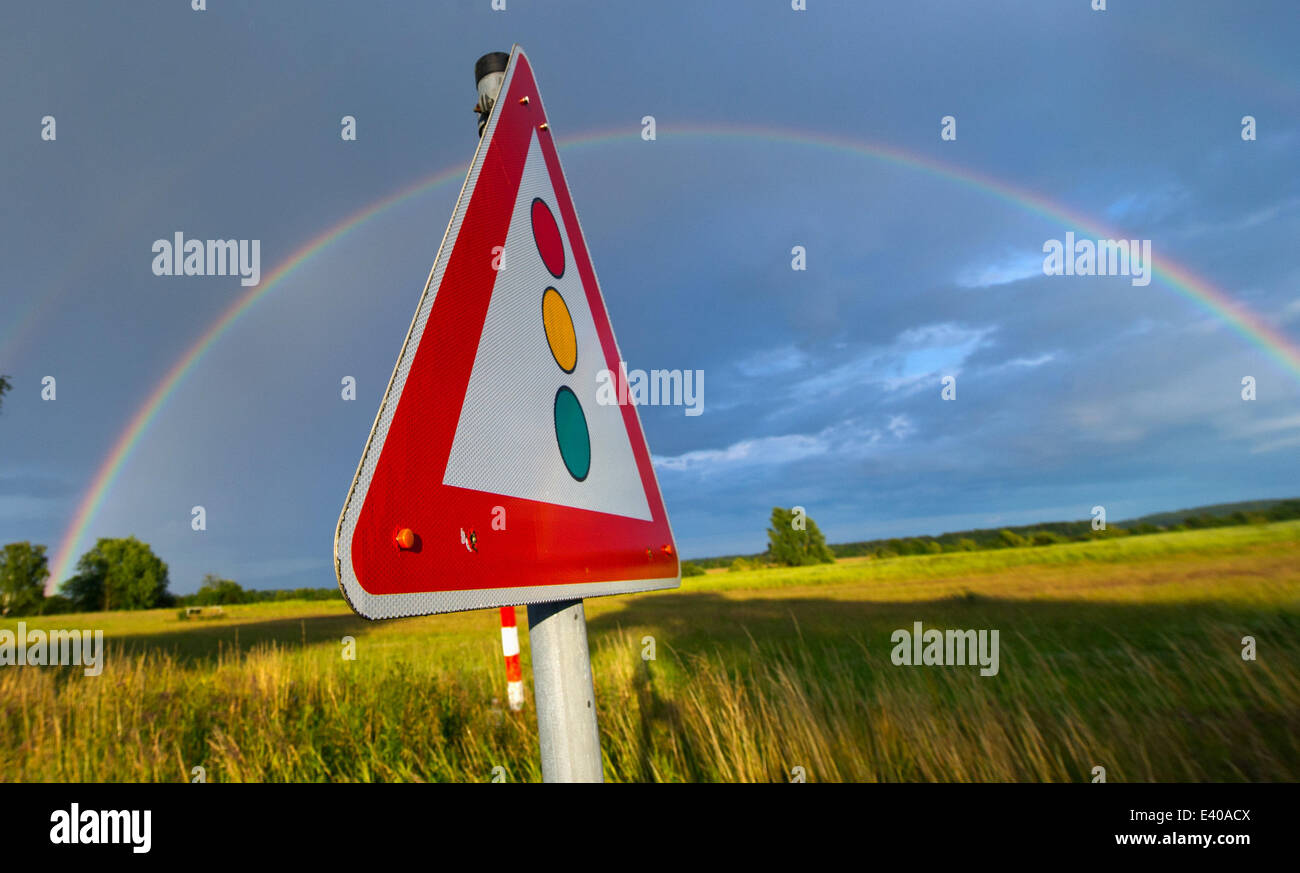A rainbow is seen in the sky over Usedom island near Trassenheide, Germany, 01 July 2014. Meteorologsits forcast changeable weather conditions with sun and rain. Photo: STEFAN SAUER/dpa Stock Photo