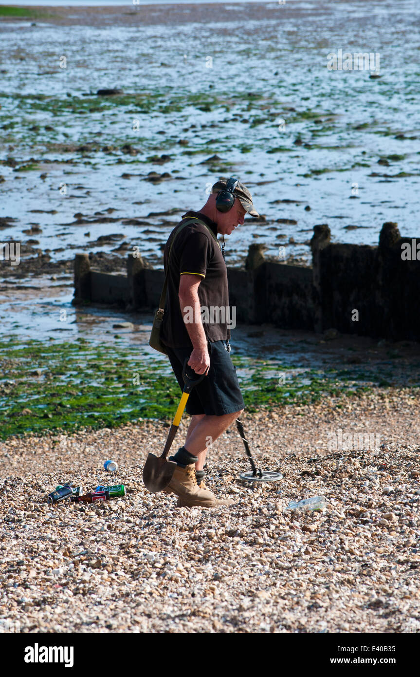 Man with metal detector on beach Whitstable Stock Photo - Alamy