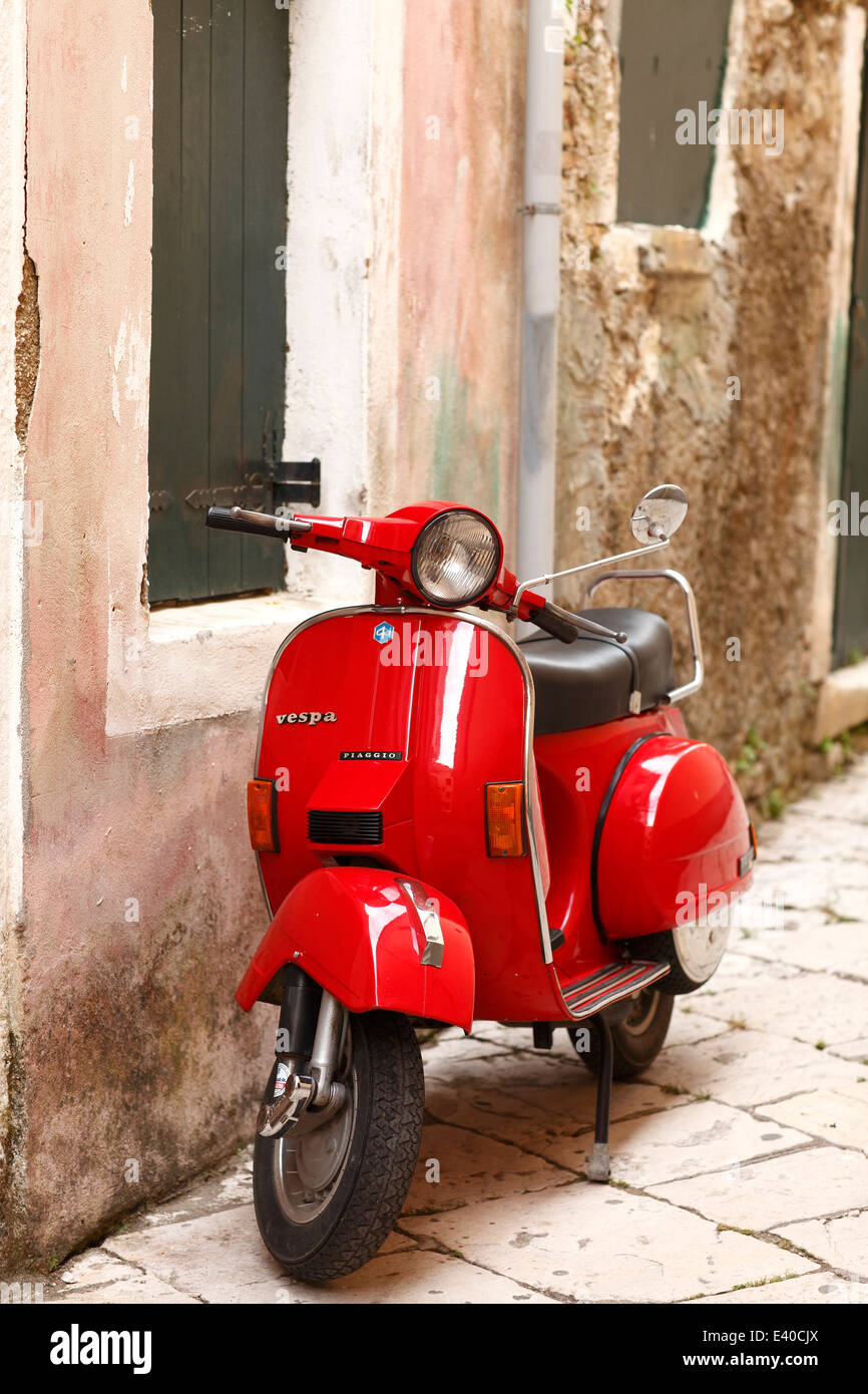 Greece, Ionic Islands, Corfu, Greece, Ionic Islands, Corfu, red old Vespa scooter parking in front of house Stock Photo