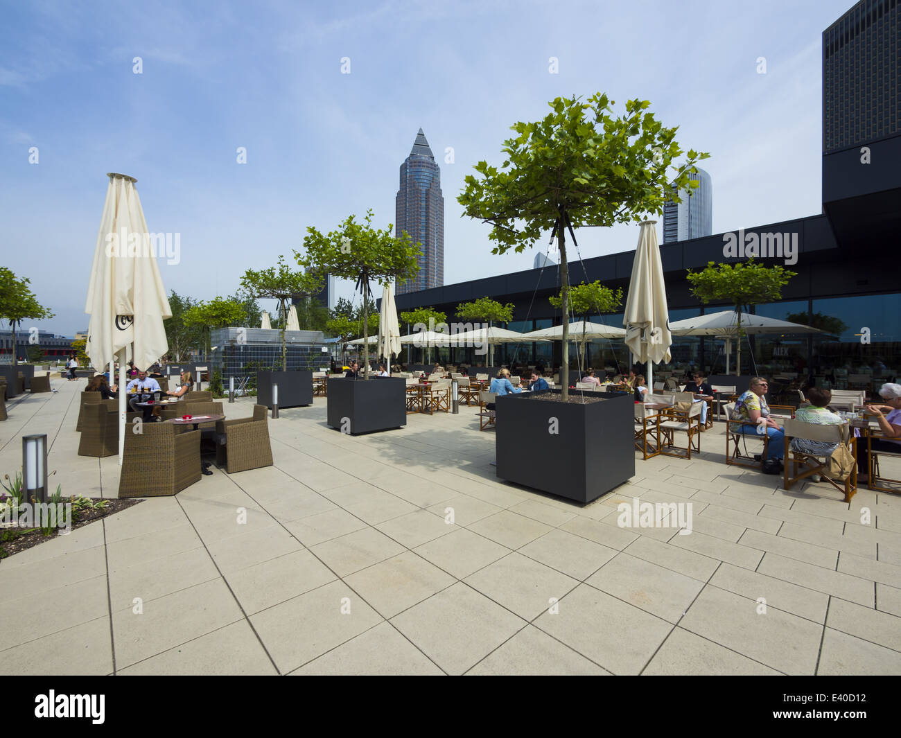 Germany, Hesse, Frankfurt, Roof terrace with restaurant and Messeturm in background Stock Photo