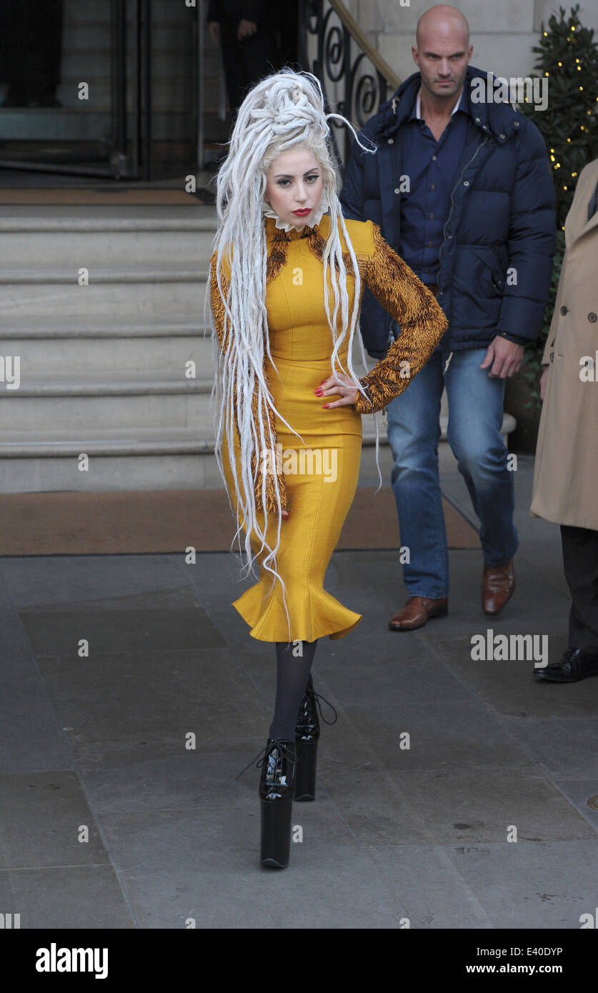 Lady Gaga leaving her hotel wearing a yellow dress and with her hair in  huge dreadlocks Featuring: Lady Gaga Where: London, United Kingdom When: 09  Dec 2013 Stock Photo - Alamy
