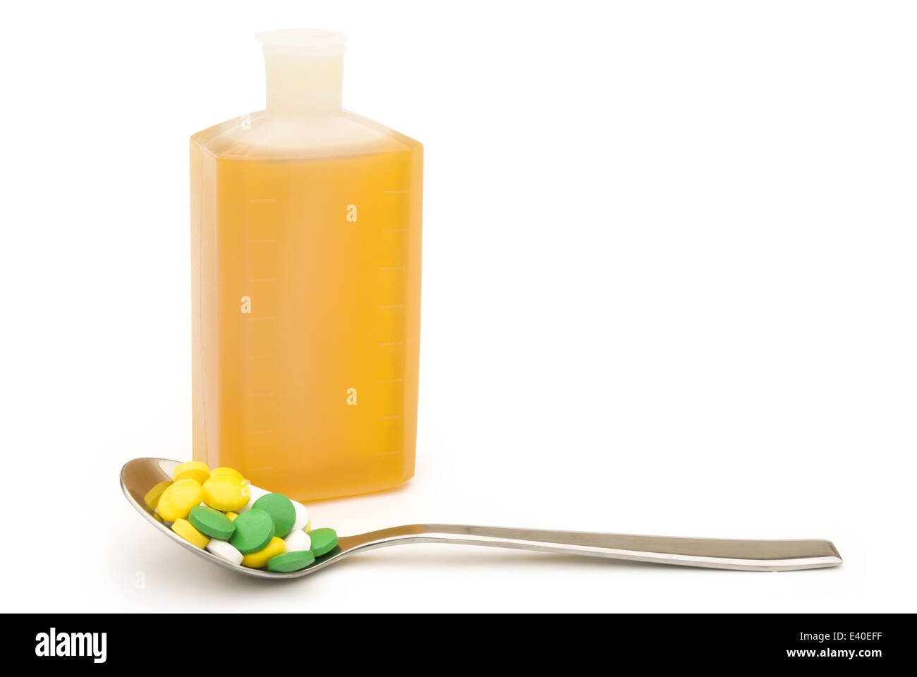 spoonful of pills and medicine bottle with clipping path Stock Photo
