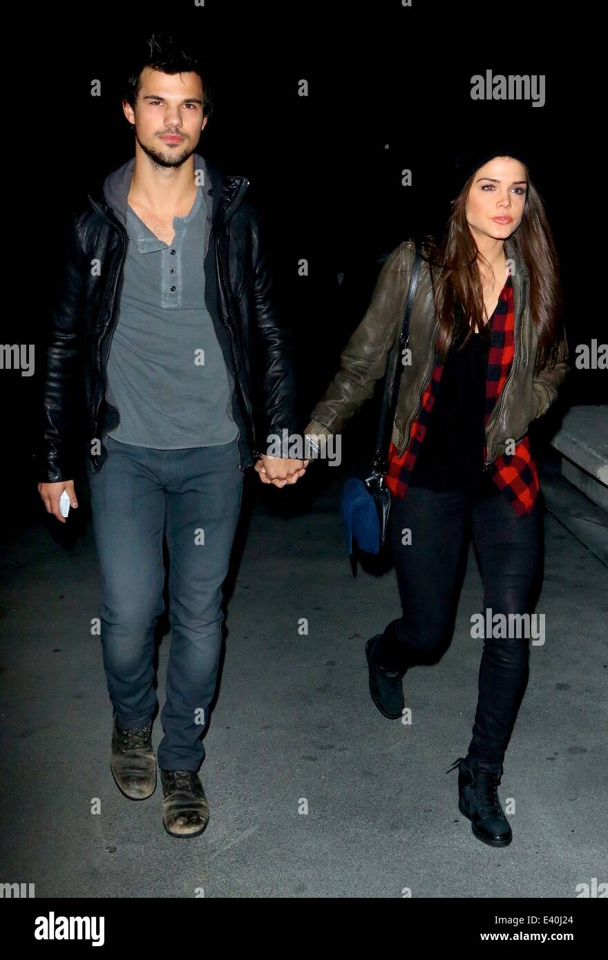 taylor lautner and marie avgeropoulos holding hands