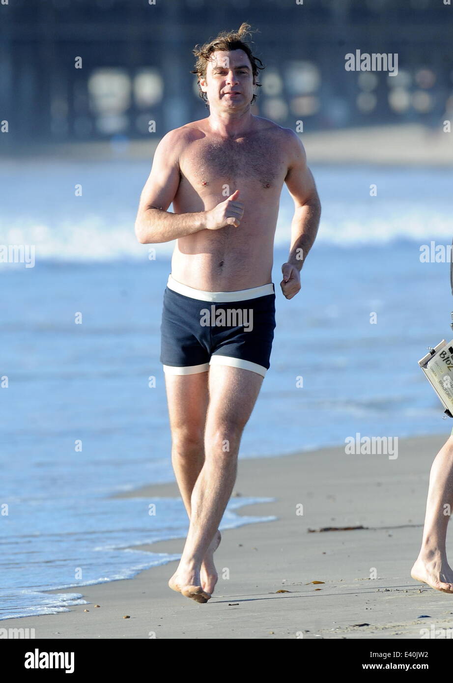 Liev Schreiber shows off his toned body on the filmset of Pawn Sacrifice  filming on Santa Monica Beach. The hunky actor was seen flexing his biceps  and running around the beach while