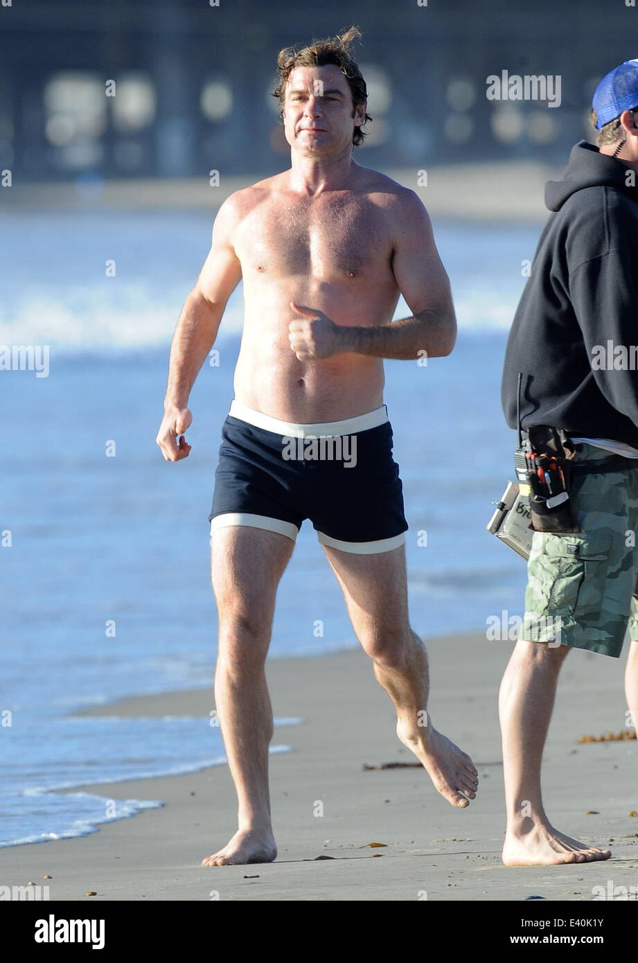 Liev Schreiber shows off his toned body on the filmset of "Pawn Sacrifice"  filming on Santa Monica Beach. The hunky actor was seen flexing his biceps  and running around the beach while