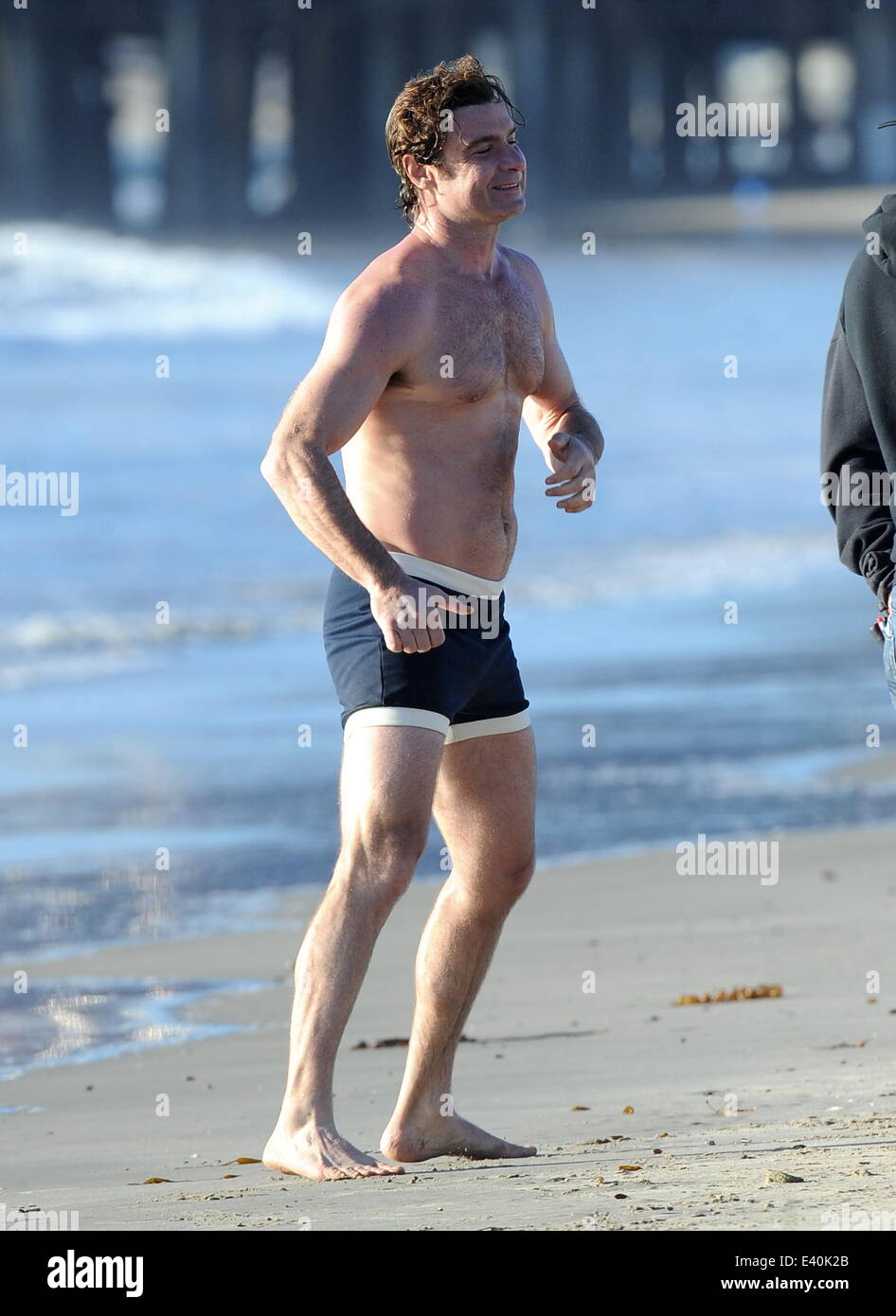 Liev Schreiber shows off his toned body on the filmset of Pawn Sacrifice  filming on Santa Monica Beach. The hunky actor was seen flexing his biceps  and running around the beach while