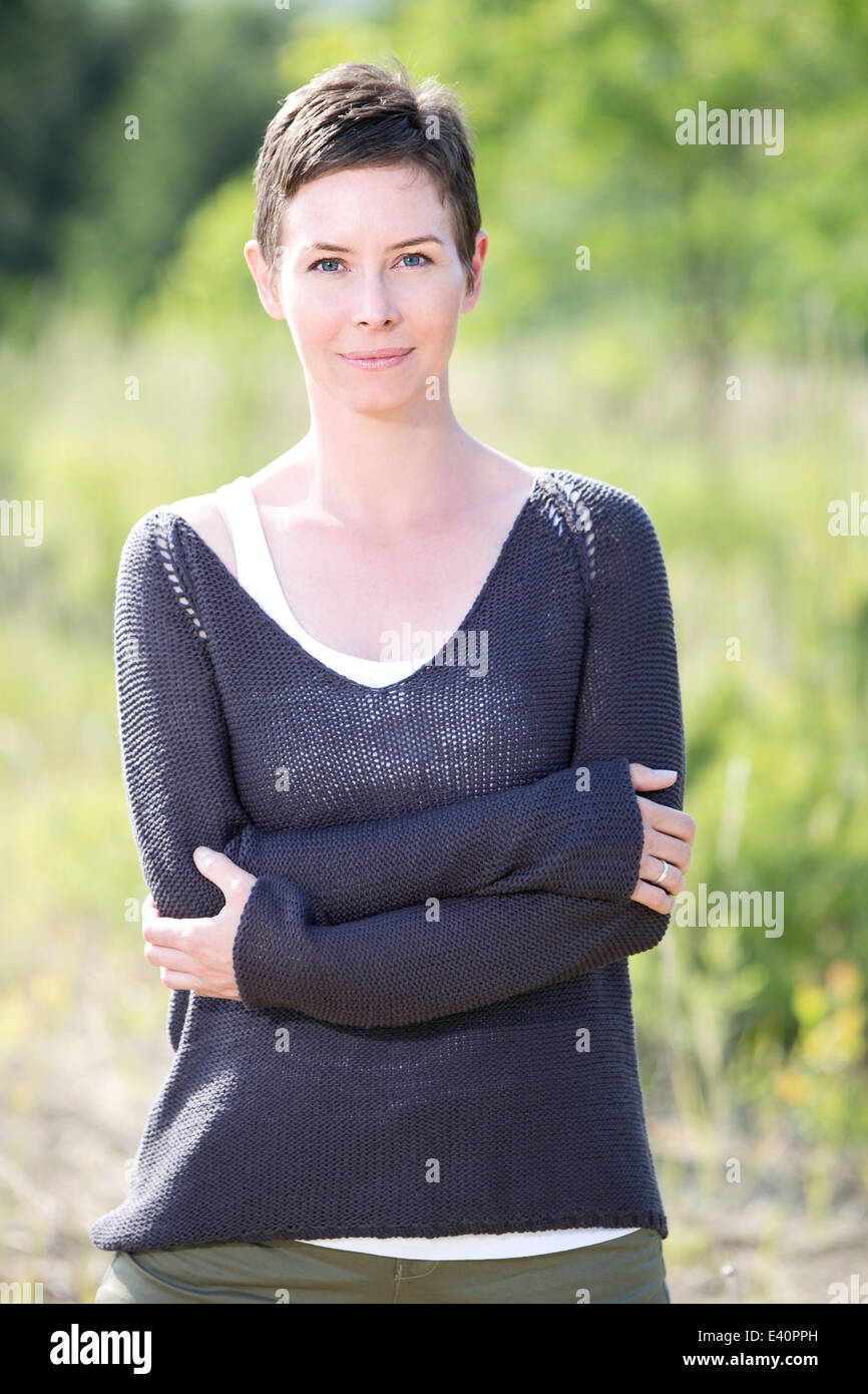 Portrait of woman with crossed arms Stock Photo - Alamy