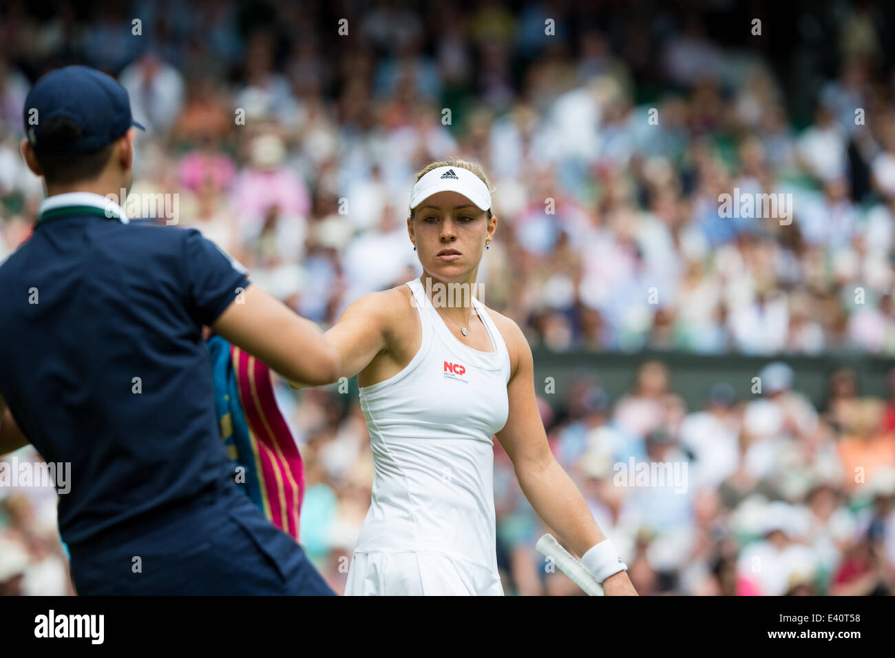 Wimbledon, London, UK. 1st July, 2014. Tennis: Wimbledon Championship 2014, Angelique Kerber of Germany during her Ladies' Singles fourth round match against Maria Sharapova of Russia on day eight of the Wimbledon Lawn Tennis Championships at the All England Lawn Tennis and Croquet Club at Wimbledon on July 1, 2014, London, England. Credit:  dpa picture alliance/Alamy Live News Stock Photo