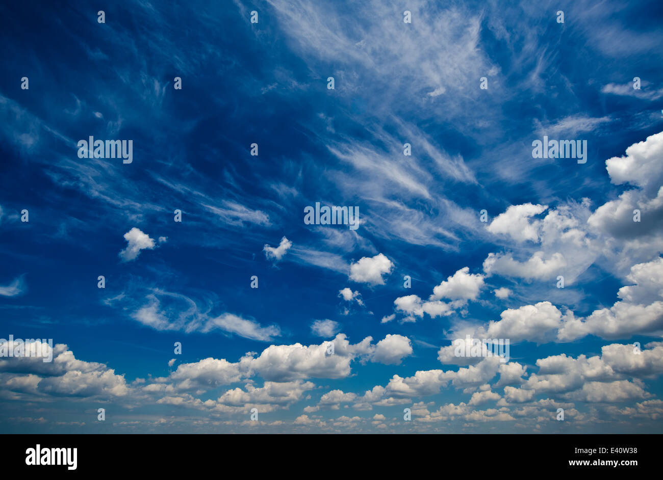 Blue daylight summer sky with fluffy white clouds as nature background ...