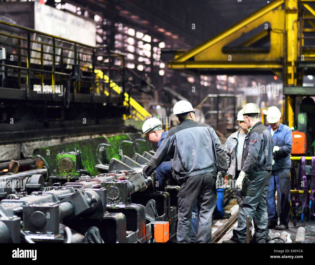 Workers doing maintenance works in a tube rolling mill Stock Photo Alamy