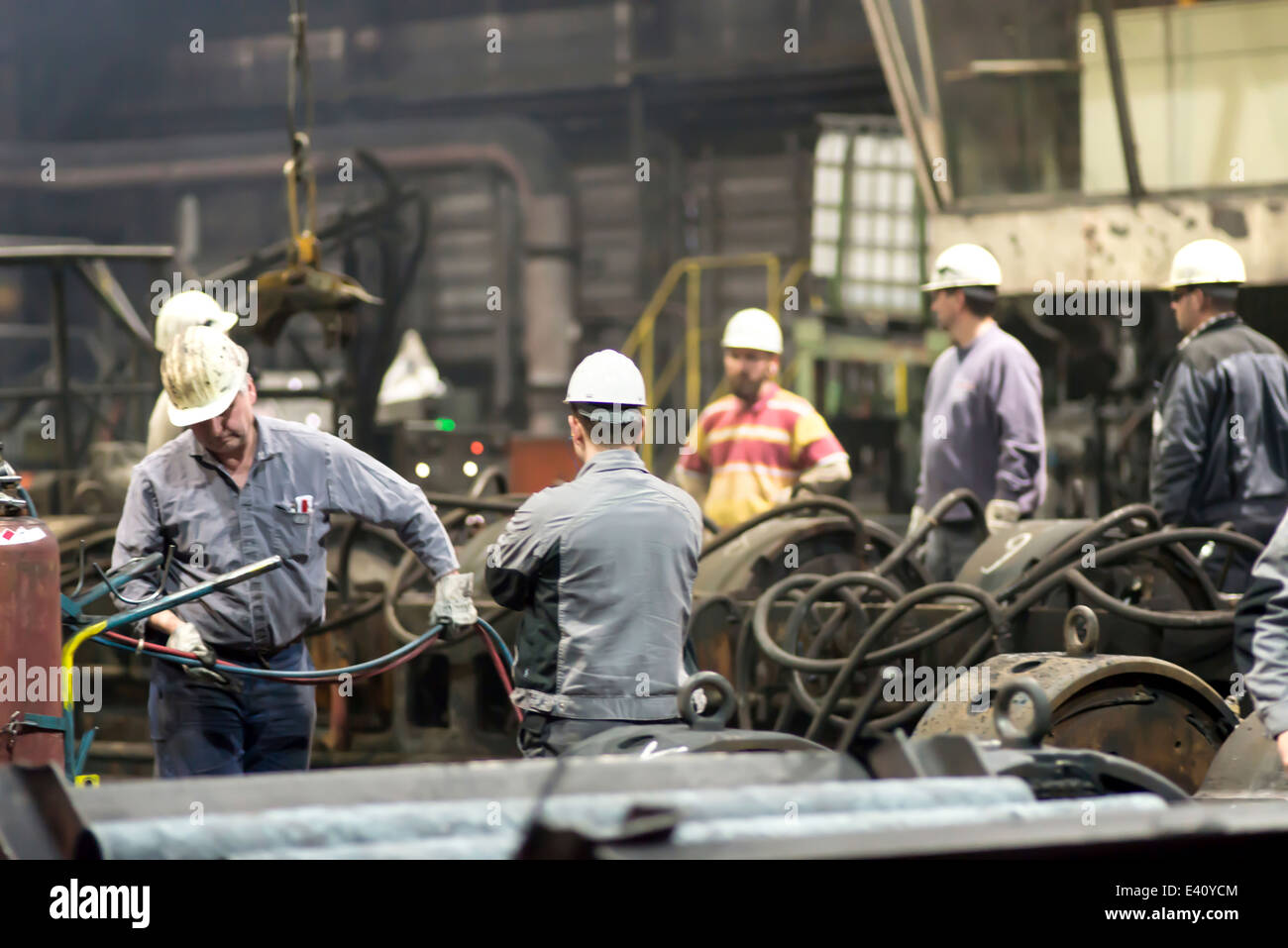 Workers doing maintenance works in a tube rolling mill Stock Photo Alamy