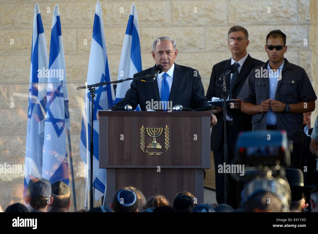 Modi'In, Israel. 1st July, 2014. Israeli Prime Ministrer Benjamin (Bibi) Netanyahu speaks during the funeral of the three kidnapped teenagers. Thousands of Israelis attended the funeral of three Israeli teenagers, Gil-Ad Shaer, Naftali Fraenkel, and Eyal Yifrah, who were kidnapped 19 days ago. The bodies of the three Israeli teenagers have been found, it was announced Monday night. The bodies were found north of the Palestinian town Halhul, just north of Hebron. (Credit Image: Credit:  Gili Yaari/NurPhoto/ZUMA Wire/Alamy Live News) Stock Photo