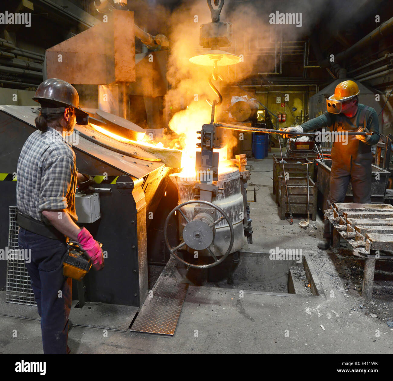 Workers in a foundry Stock Photo