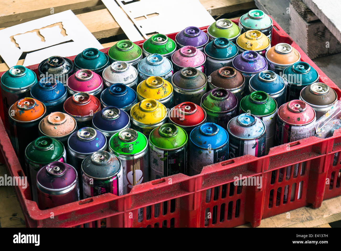 Plastic box of aerosol cans of spray paint Stock Photo