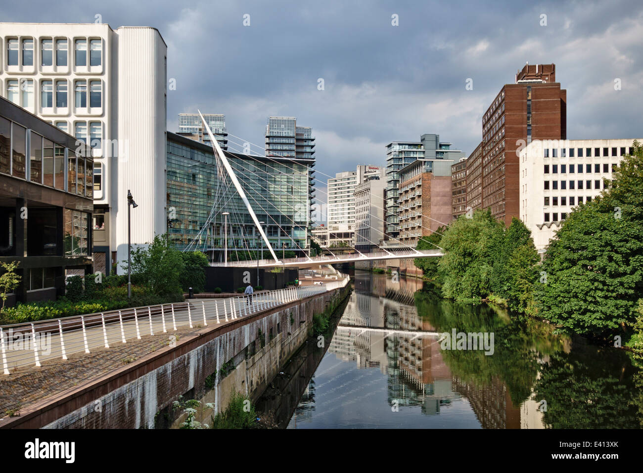 Manchester, UK. The Lowry Hotel and Trinity Bridge over the River Irwell between Salford and Manchester Stock Photo