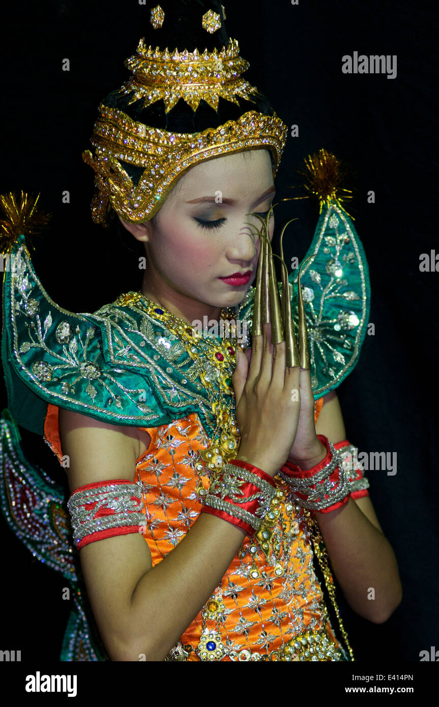 World cultures, a traditional Thai dancer w/ elongated fingernails gives a traditional wai to the audience, Bangkok, Thailand. credit: Kraig Lieb Stock Photo