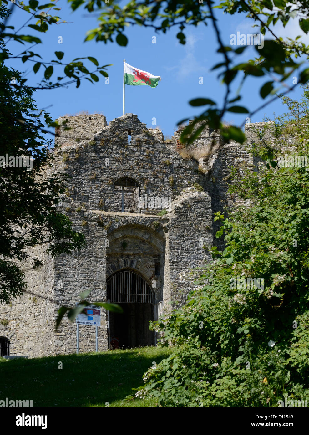 Oystermouth castle entrance with welsh flag flying in village of Mumbles. Mumbles was voted best place to live in Wales 2018. Stock Photo