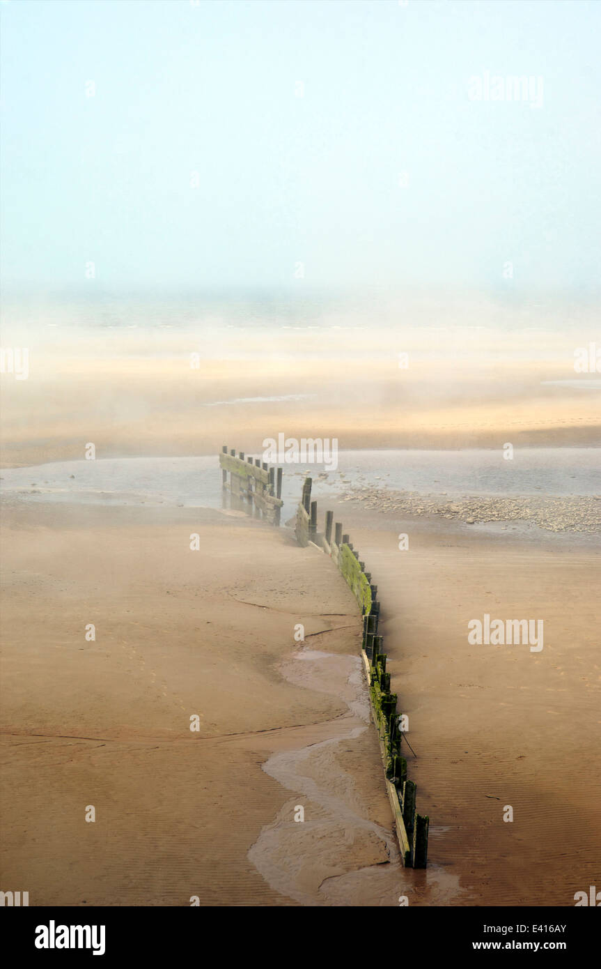 Sea mist coming ashore on a hot summer day Stock Photo