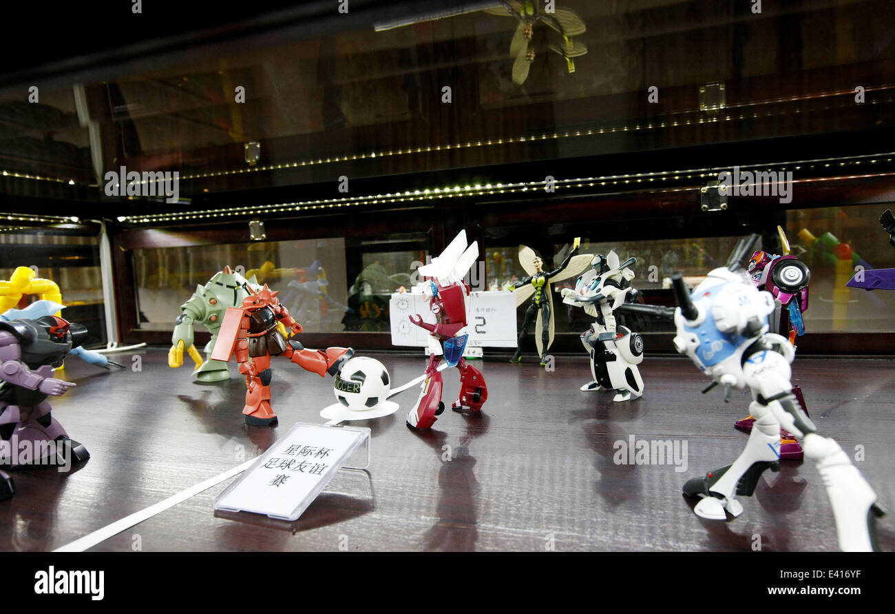 Shanghai, China's Shanghai. 2nd July, 2014. Photo taken on July 2, 2014 shows a collection of robot models at an old toy exhibition in east China's Shanghai, July 2, 2014. The toys presented on the exhibition, from the collections of 18 collectors, remind visitors born in the 1970s and the 1980s of their childhood. Credit:  Fang Zhe/Xinhua/Alamy Live News Stock Photo