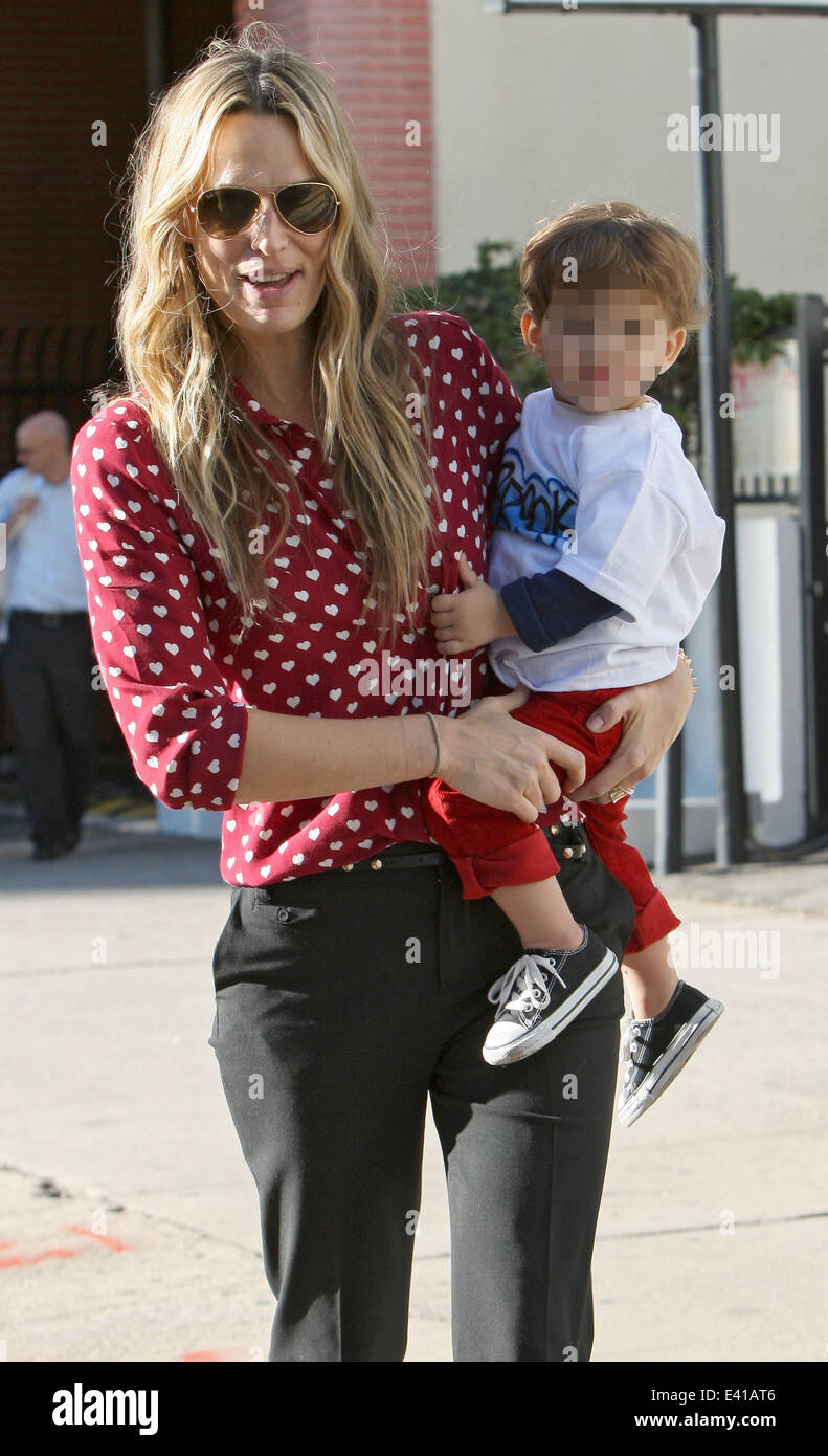Molly Sims carries her son Brooks as she leaves a Baby2Baby event(01)