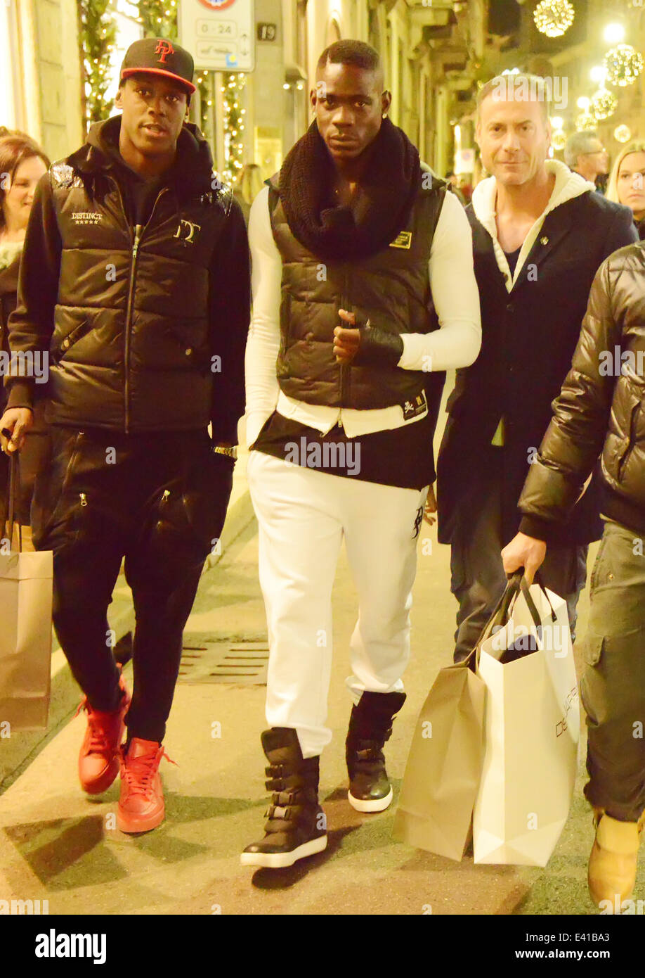 Mario Balotelli goes shopping with his brother Enoch and his bodyguard in  Via Montenapoleone Featuring: Mario Balotelli,Enoch Barwuah Where: Milan,  Italy When: 14 Dec 2013 Stock Photo - Alamy