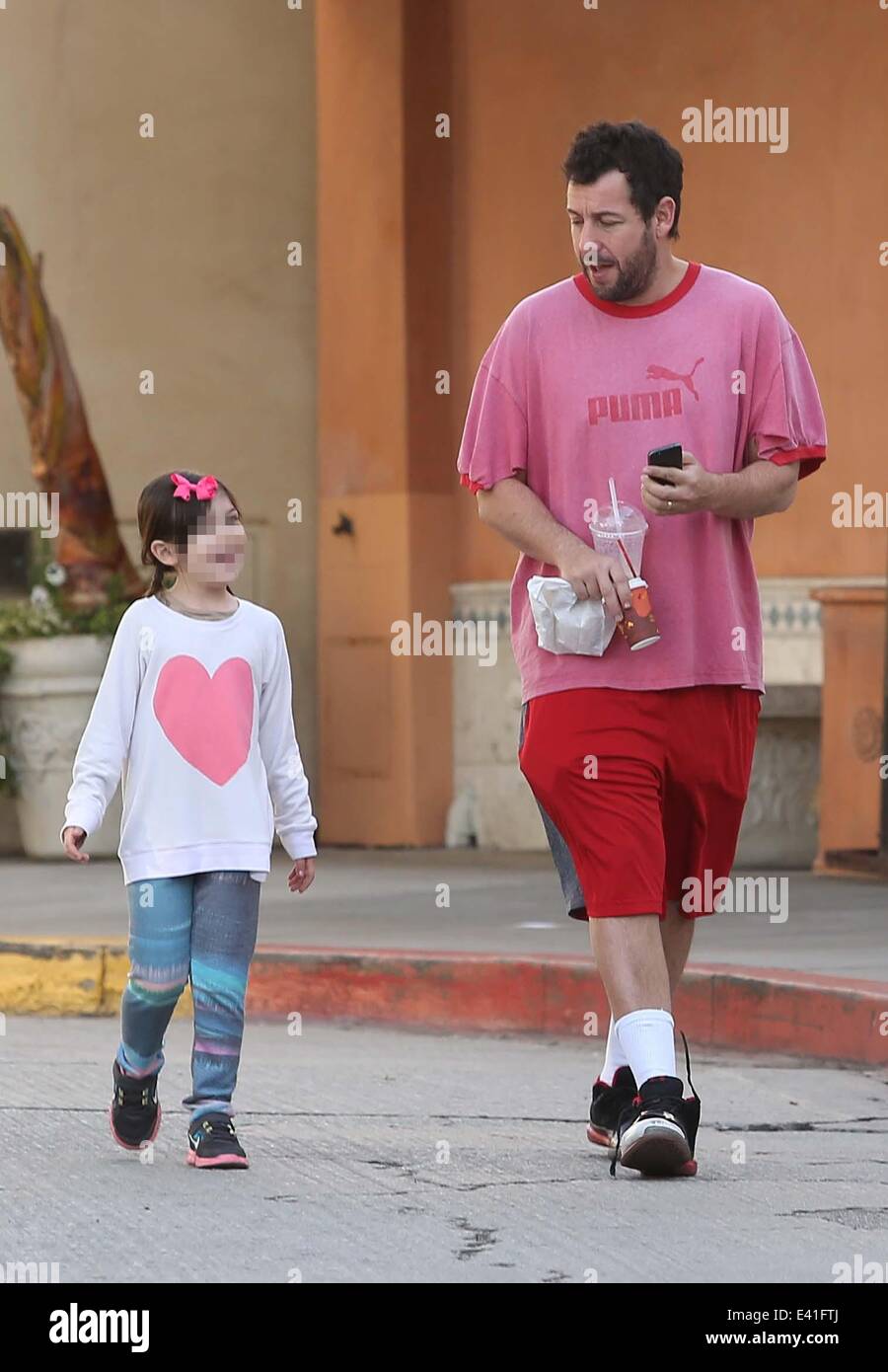 Adam Sandler out and about with his daughter Sunny in Brentwood