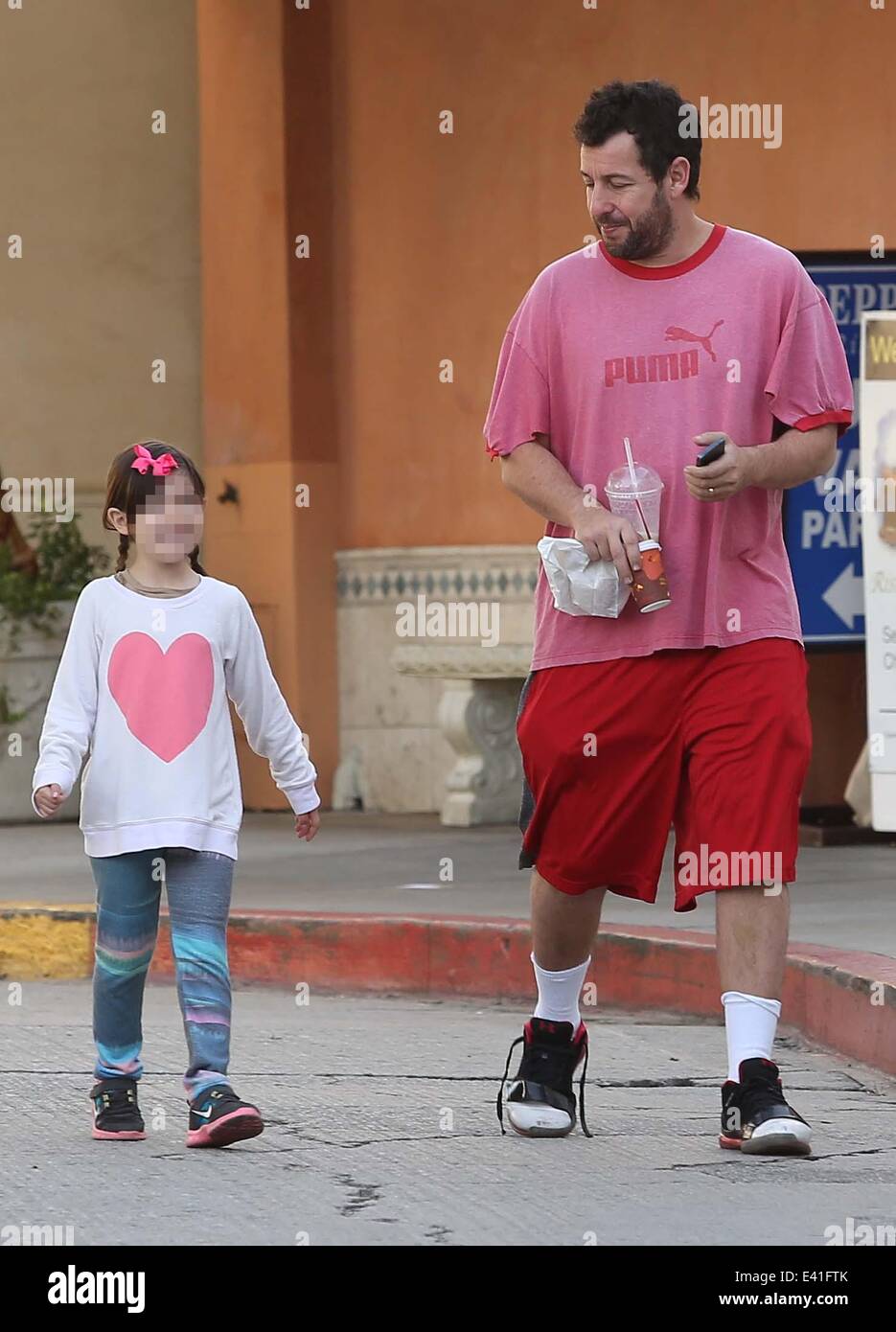 Adam Sandler out and about with his daughter Sunny in Brentwood