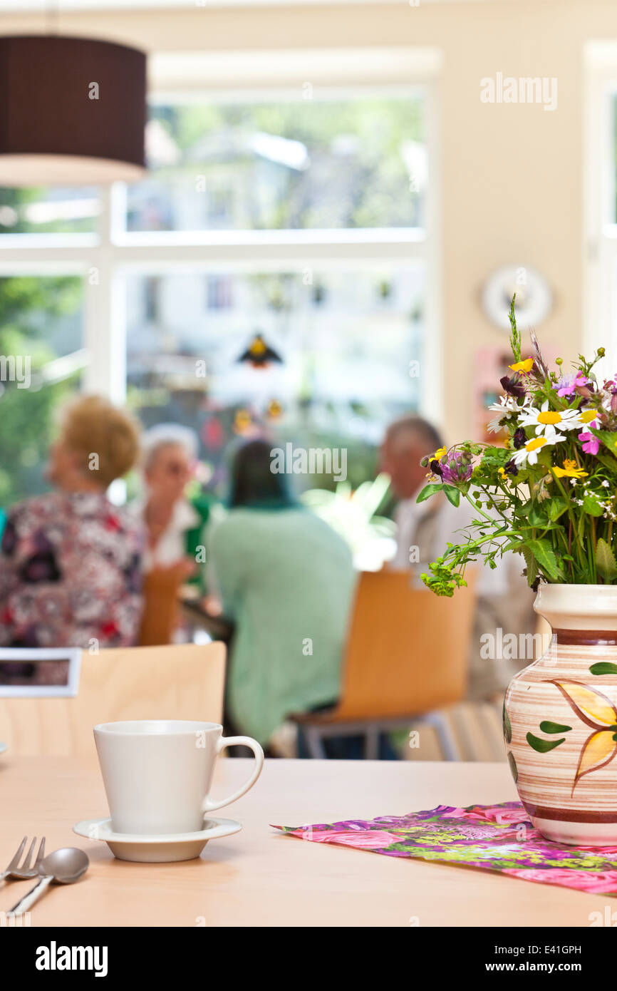 Senior Community in a retirement home having breakfast Stock Photo