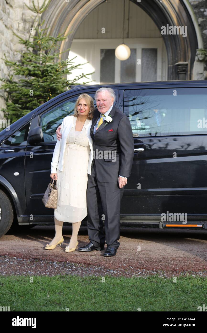 89 year old Leslie Philips seen arriving with his bride Zara Carr, who is about half his age, at a church near their home for the marriage to be blessed.  Featuring: Leslie Philips,Zara Carr Where: London, United Kingdom When: 20 Dec 2013 Stock Photo