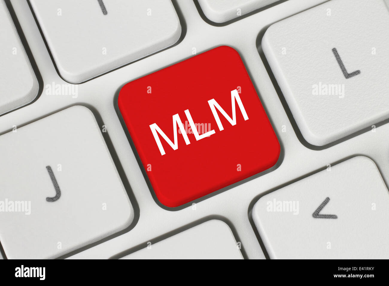 Red MLM (Multi Level Marketing) button on keyboard close-up Stock Photo
