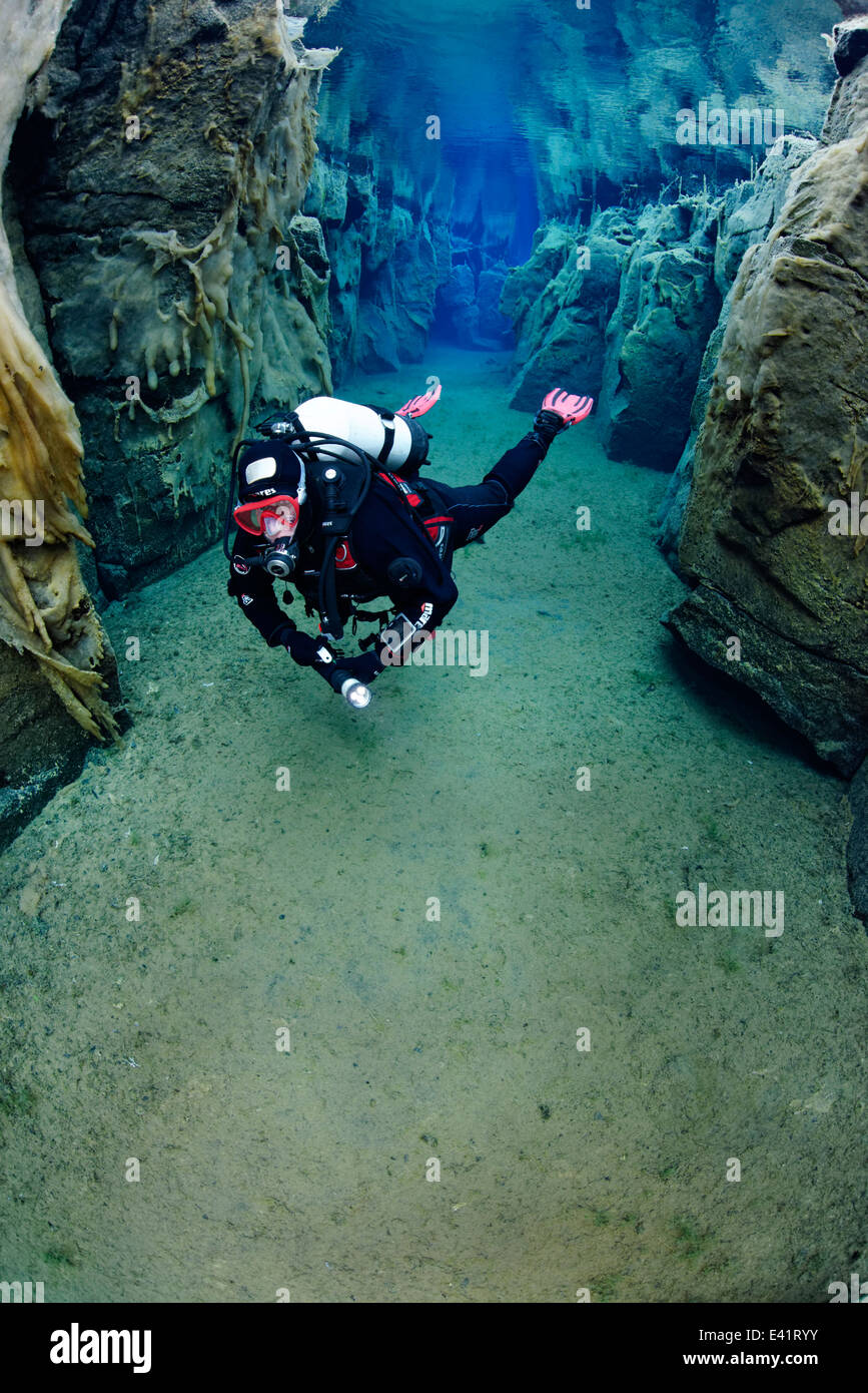 scuba divier in Nesgja, small fissure in the North of Iceland, Nesgja, Akureyri, North Iceland Stock Photo