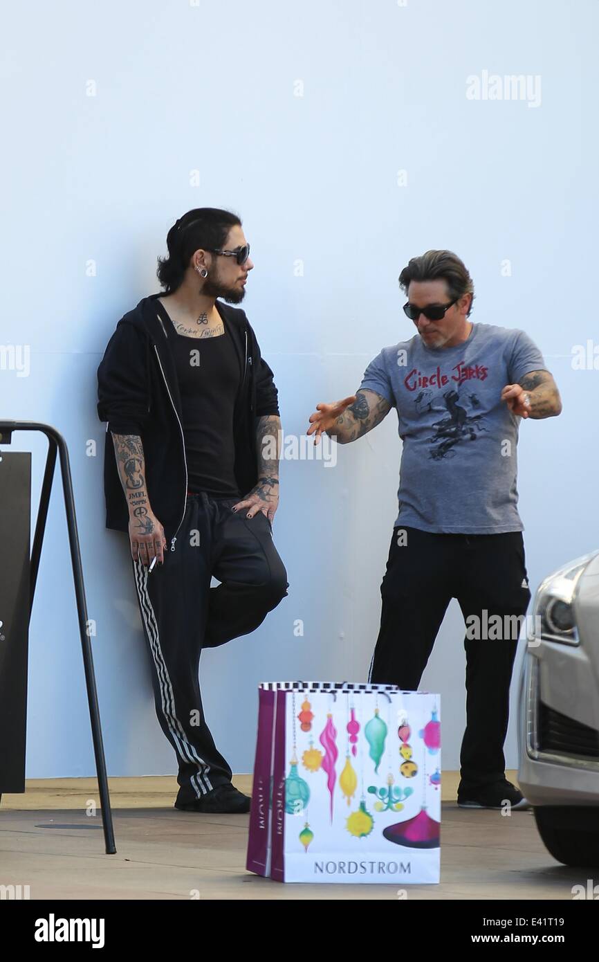 Dave Navarro and a friend smoking a cigarette while checking the brand New  Cadillac CTS at the Valet of The Grove Shopping Mall in West Hollywood  Featuring: Dave Navarro Where: Los Angeles,