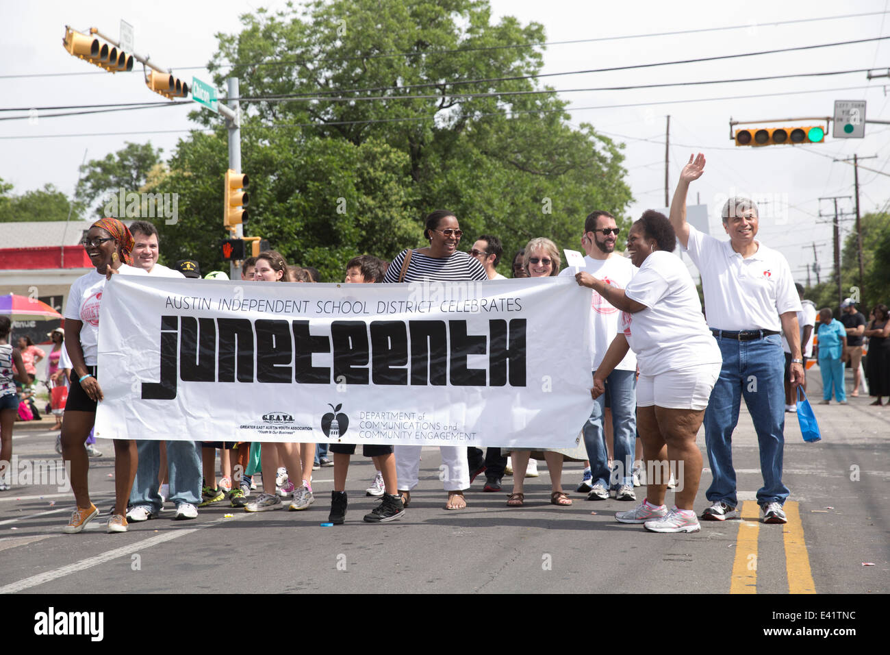 parade in Austin, Texas includes crowds dancers politicians