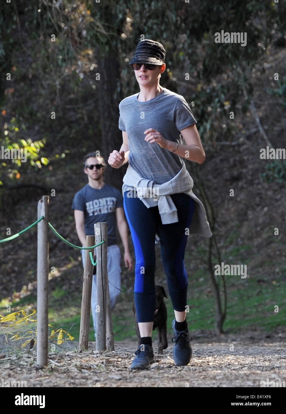 Anne Hathaway jogging with husband Adam Shulman and their dog at a hiking  trail in Beverly