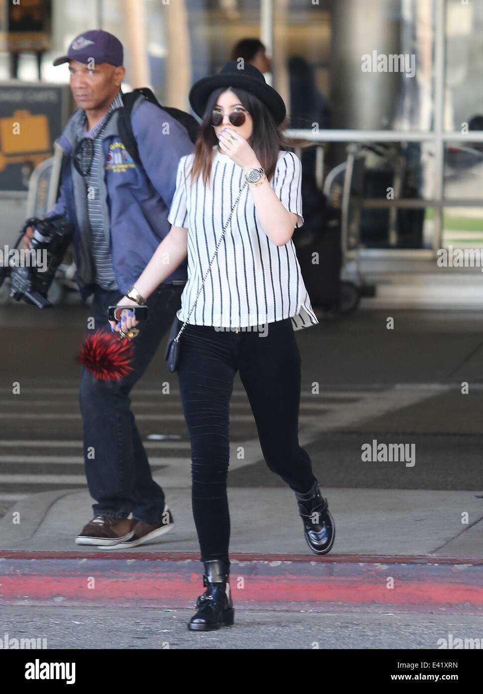 Kylie Jenner and a friend at Los Angeles International Airport Featuring: Kylie  Jenner Where: Los Angeles, California, United States When: 27 Dec 2013  Stock Photo - Alamy