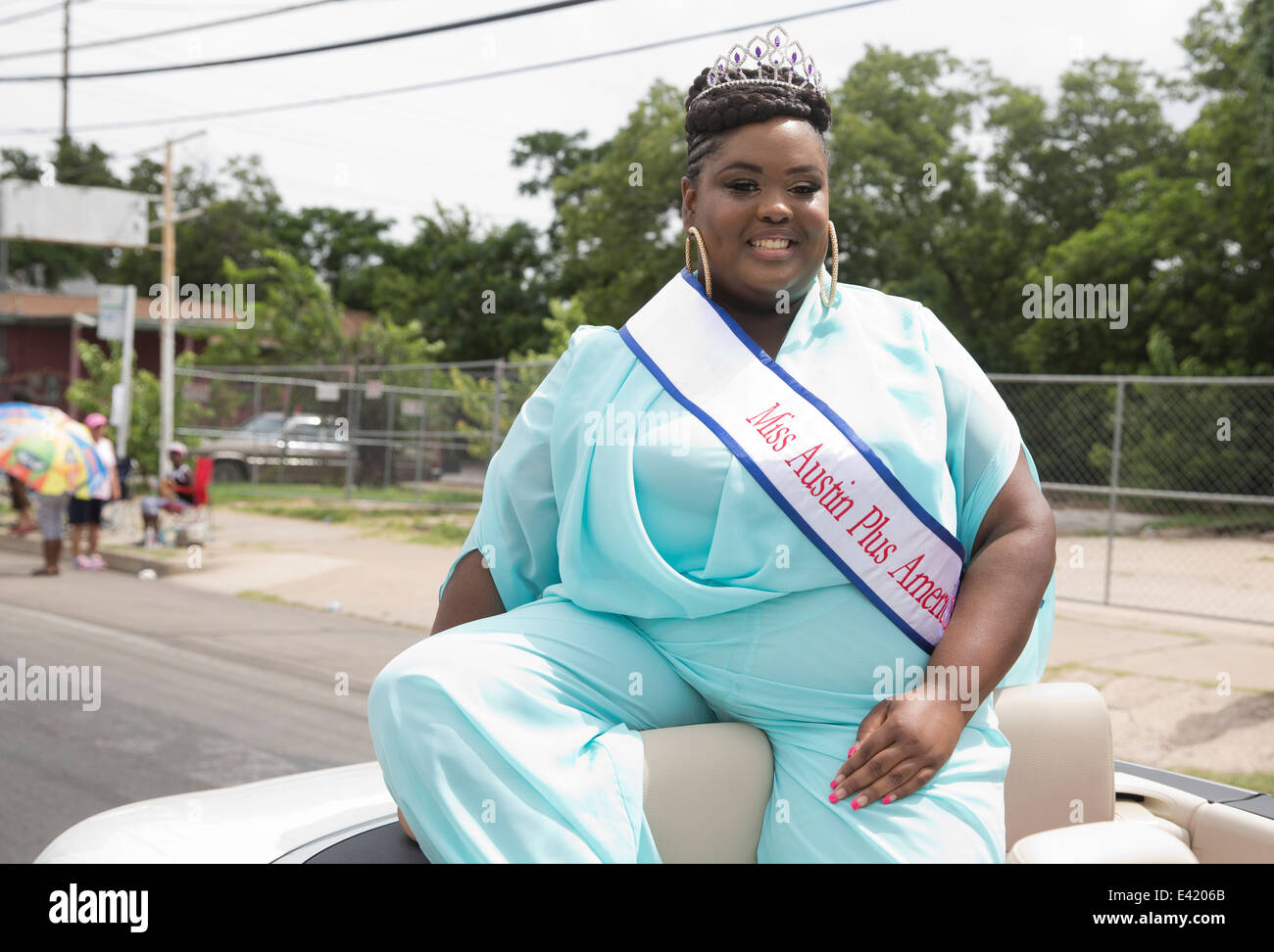 Miss Austin Plus America wears crown during a Juneteenth celebration parade in Austin, Texas Stock Photo