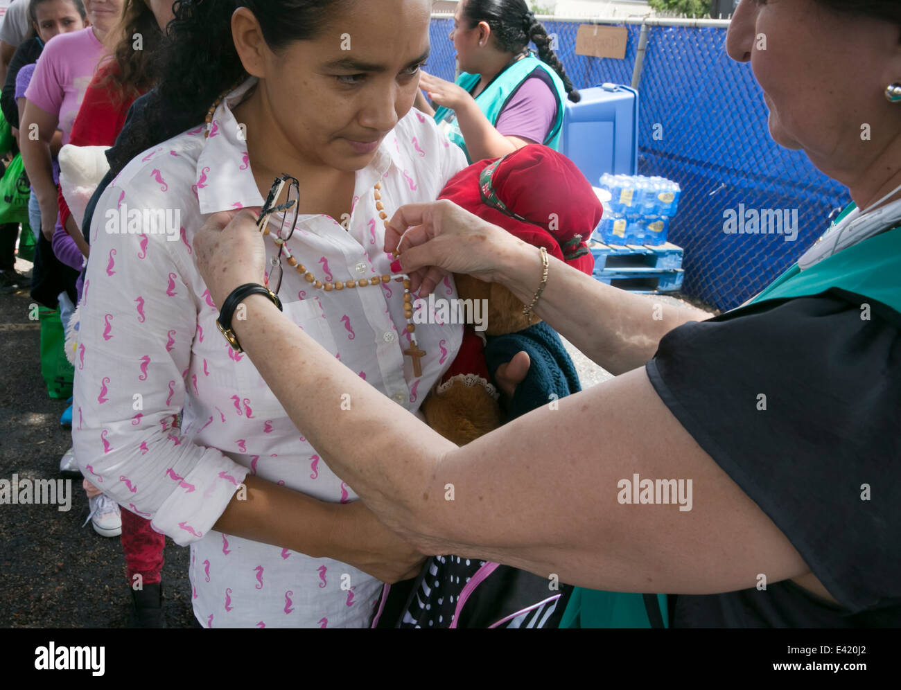 recently arrived to the USA immigrants receive food, shelter from Catholic Charity shelter in McAllen, Texas Stock Photo