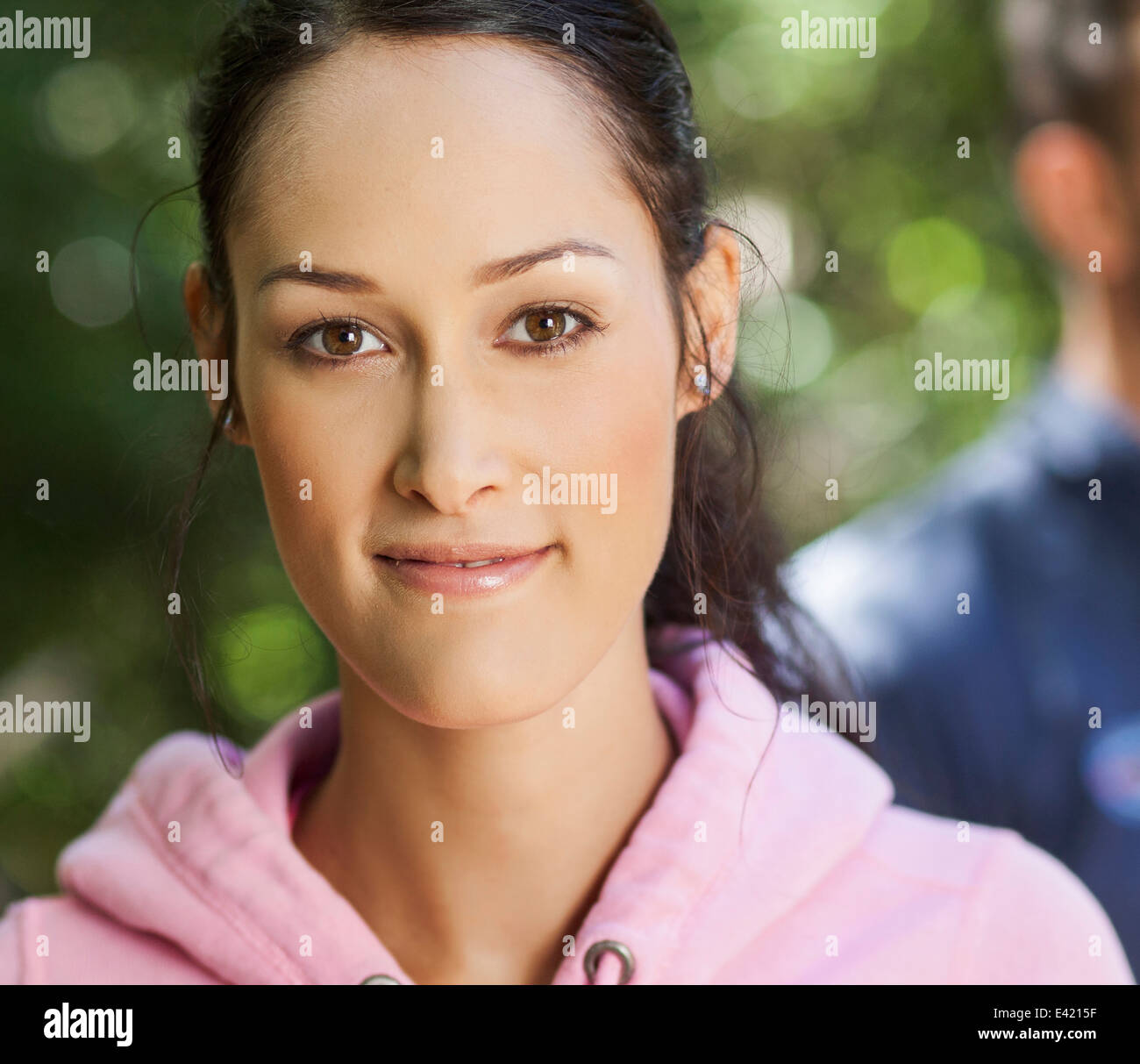 Young woman in pink hoodie Stock Photo - Alamy
