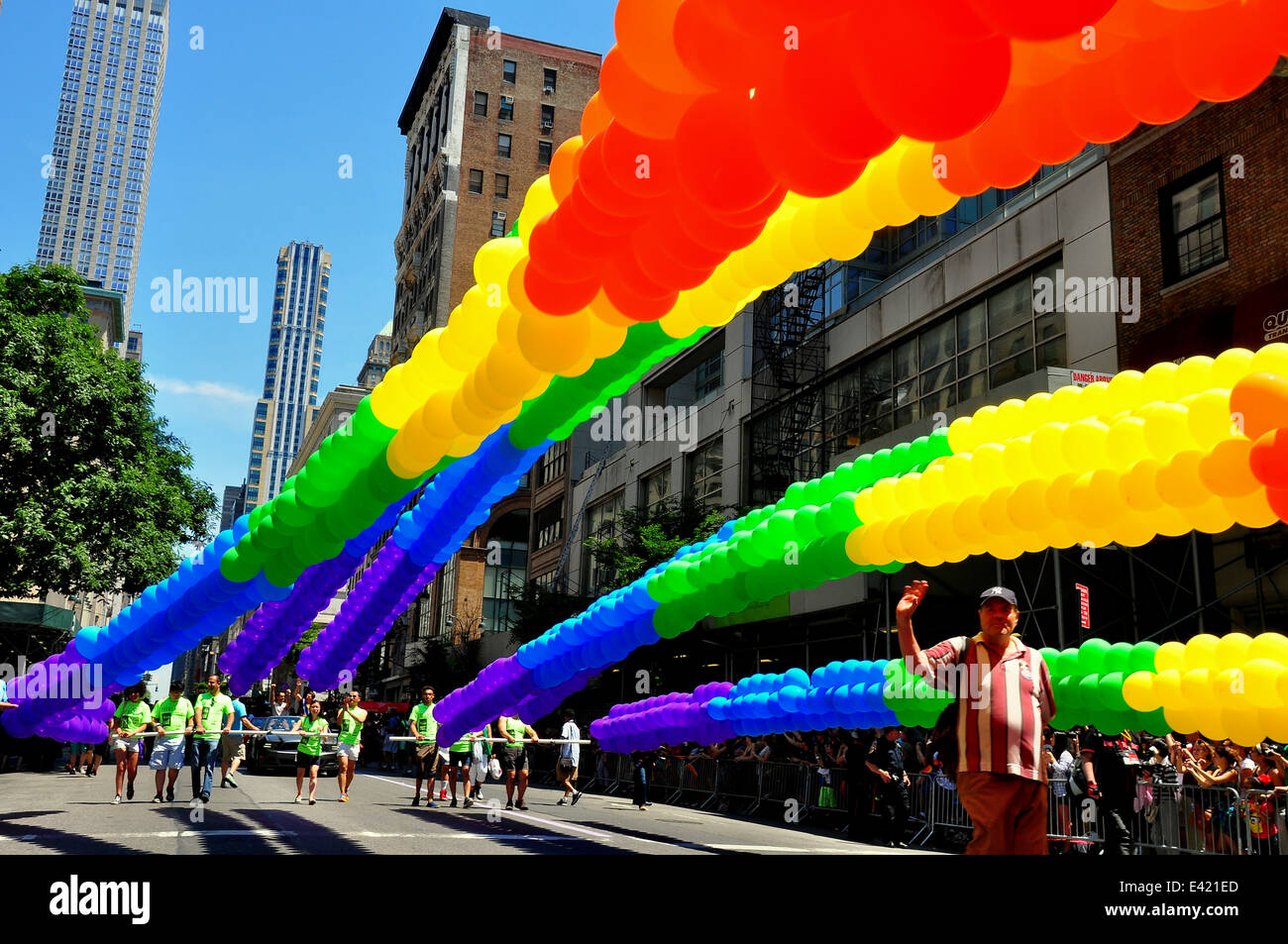 NYC: Immense balloon sprays in the rainbow colours make their way down Fifth Avenue during the 2014 Gay Pride Parade * Stock Photo