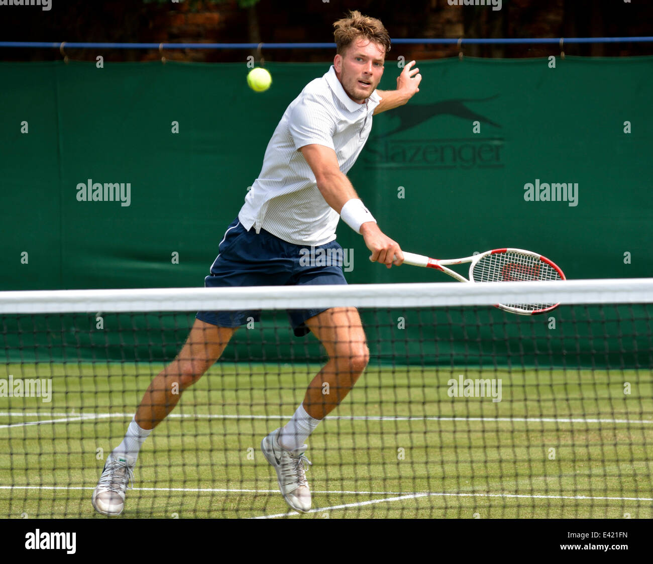 Manchester, UK. 2nd July, 2014. Lewis Burton plays a backhand return during  his second round defeat by Brydon Klein (Seed 4) 3-6, 6-3, 3-6 at the Aegon  GB Pro Tennis Tournament at