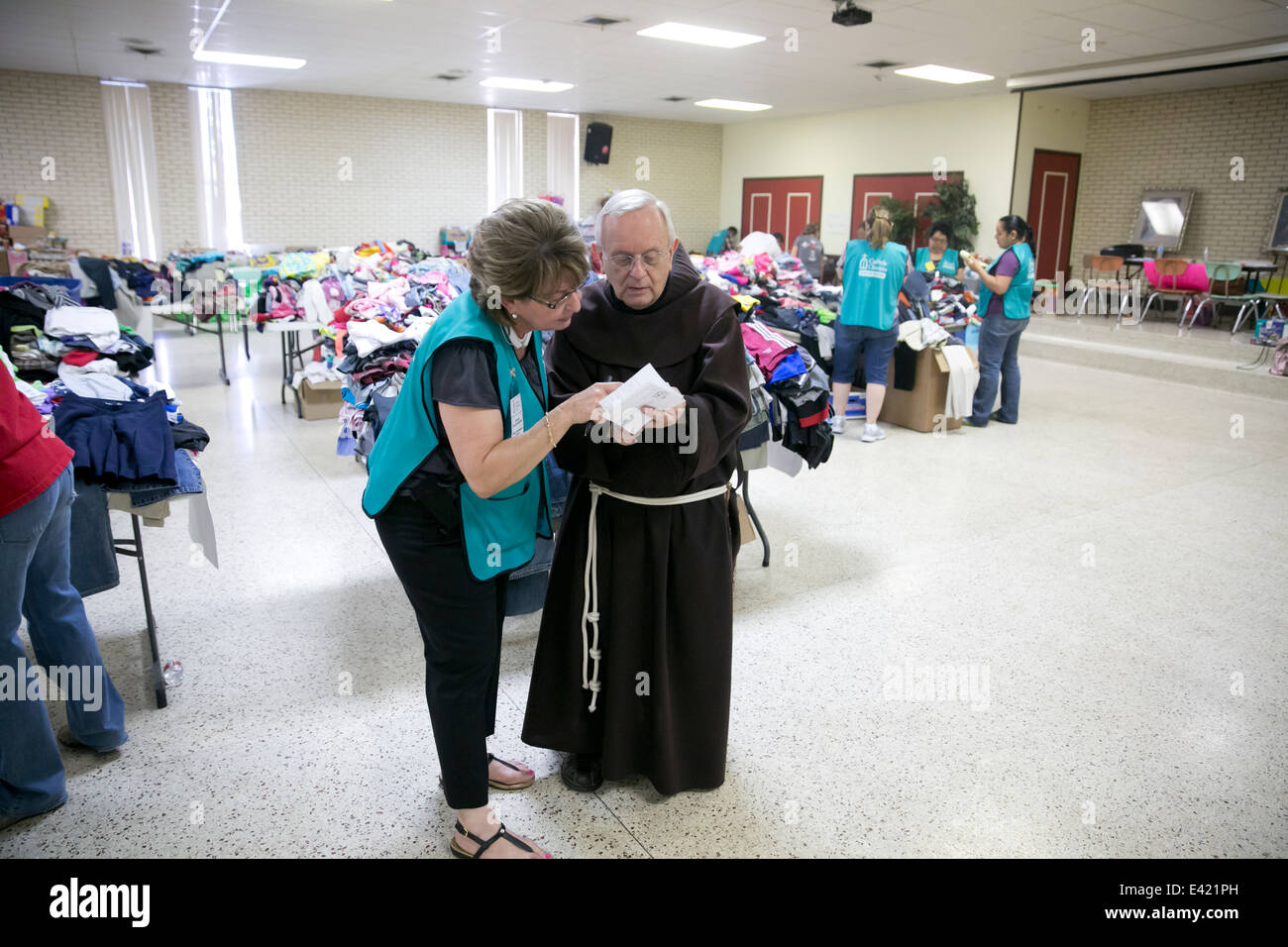 volunteers at Catholic Charity shelter in McAllen, Texas. Surge of immigrants from Central America crossed  Texas-Mexico border Stock Photo