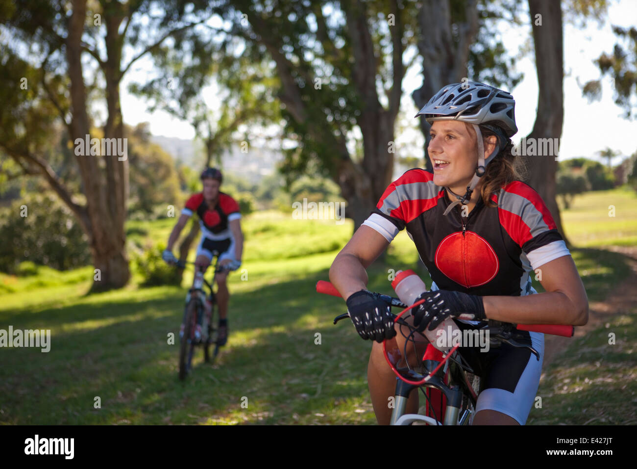 Female cyclist on bicycle taking break Stock Photo Alamy