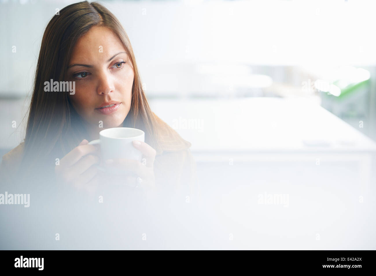 Woman taking coffee break Stock Photo