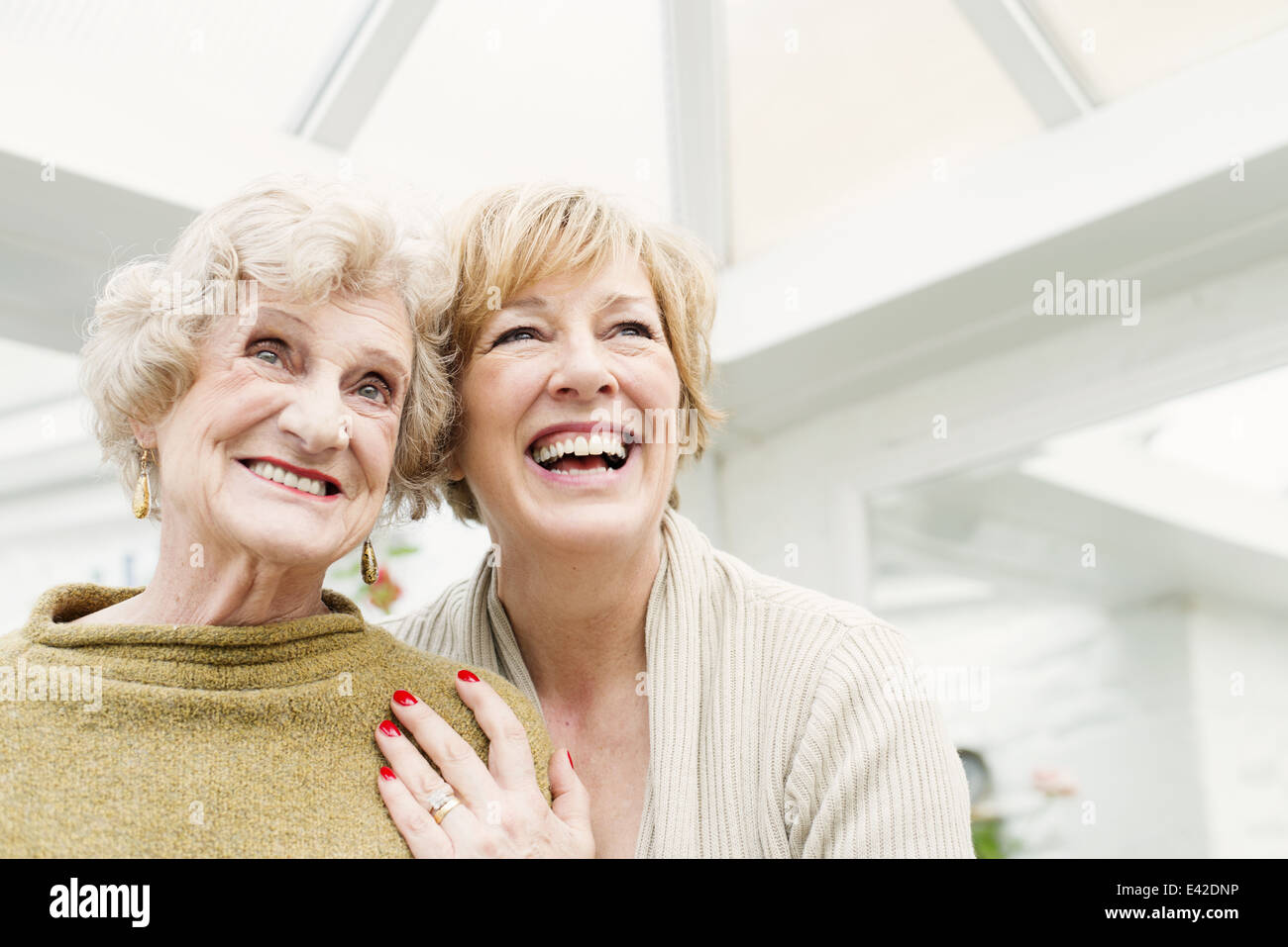 Senior woman with daughter, laughing Stock Photo