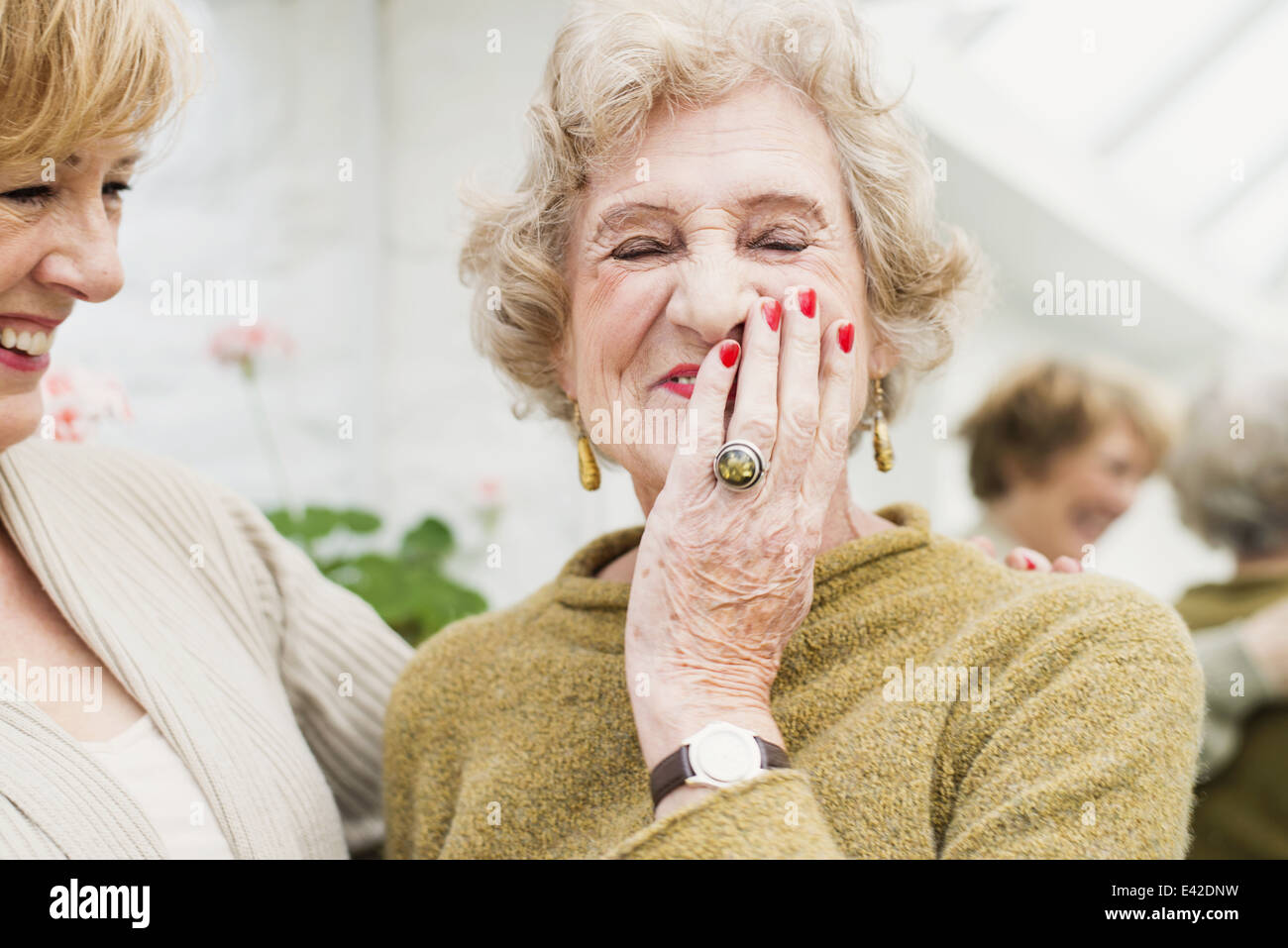 Senior woman with daughter, laughing Stock Photo